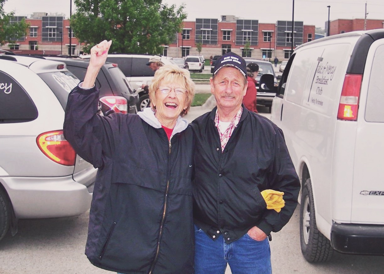 De and Mel Briles in front of the vans they use to transport donations