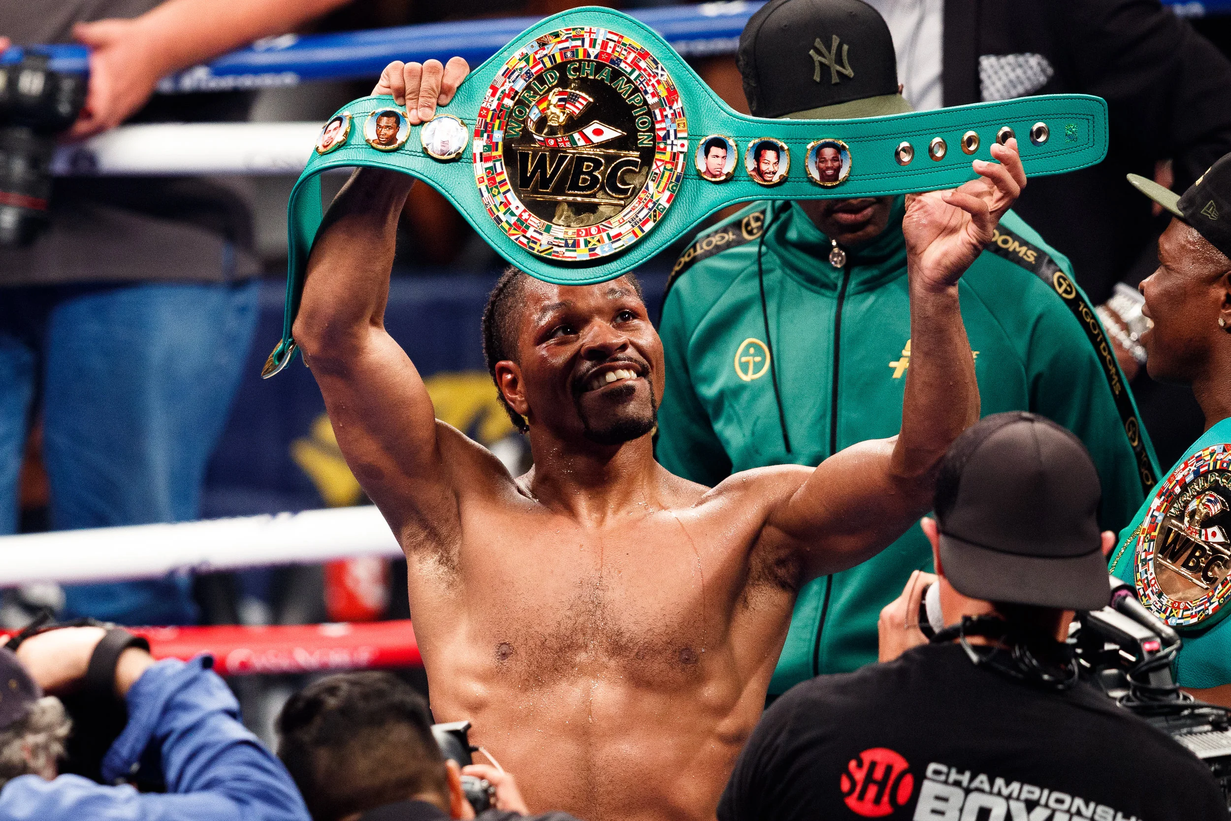 Shawn Porter raises his WBC title