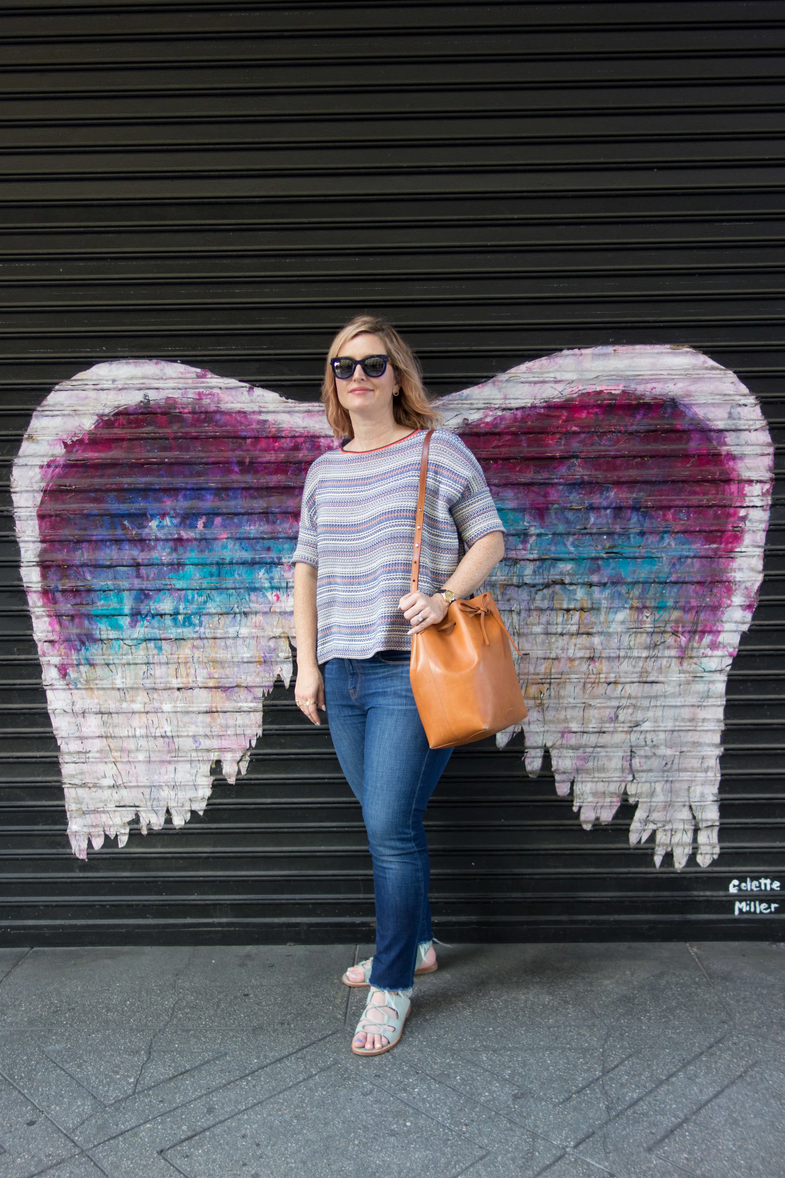 The Wings by Colette Miller. I'm wearing Thierry Lasry Sunglasses, Frame Denim jeans, Mansur Gavriel bucket bag, Ba&sh top