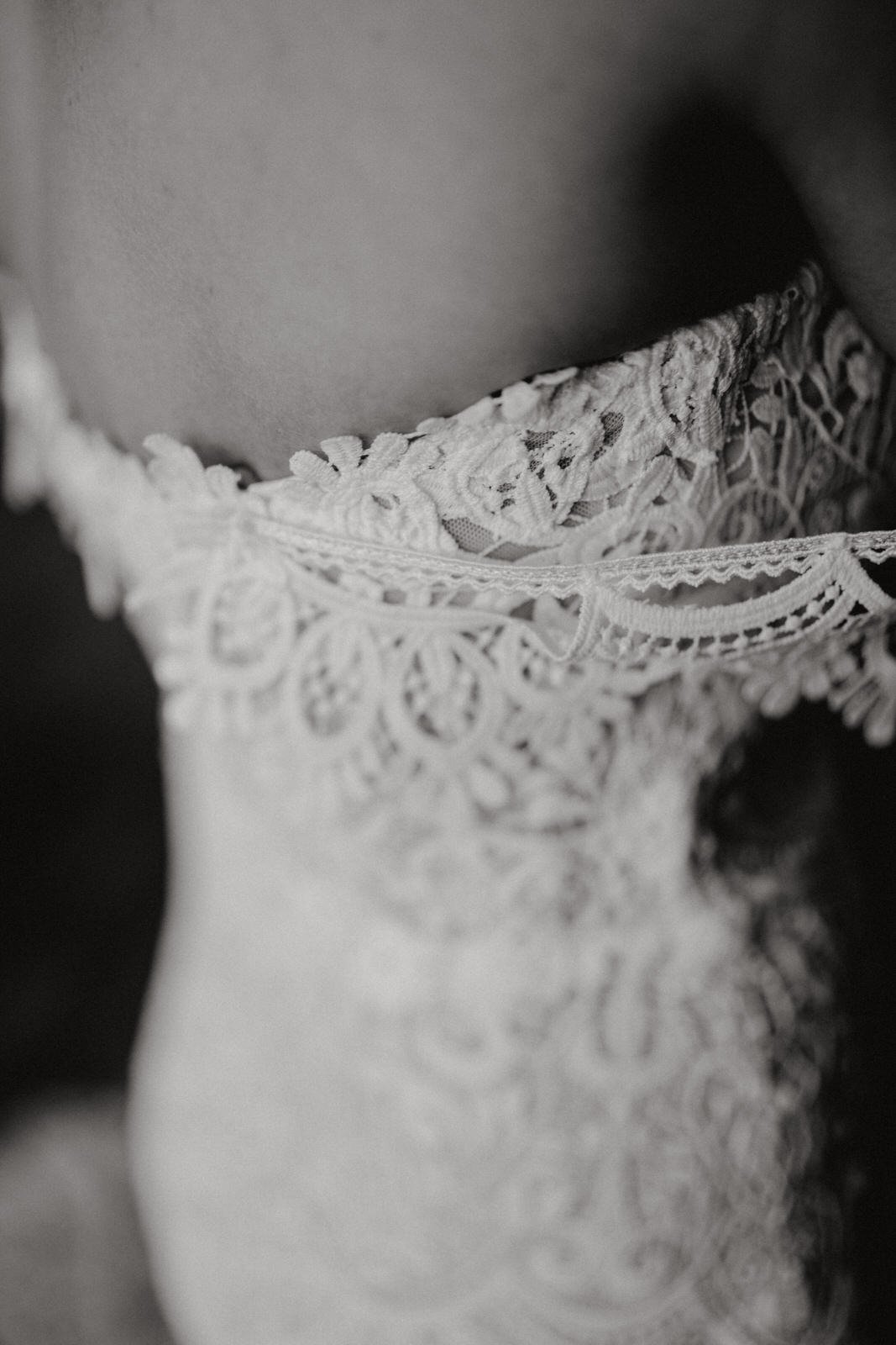 dress detail shot, black and white at hidden hive wedding venue