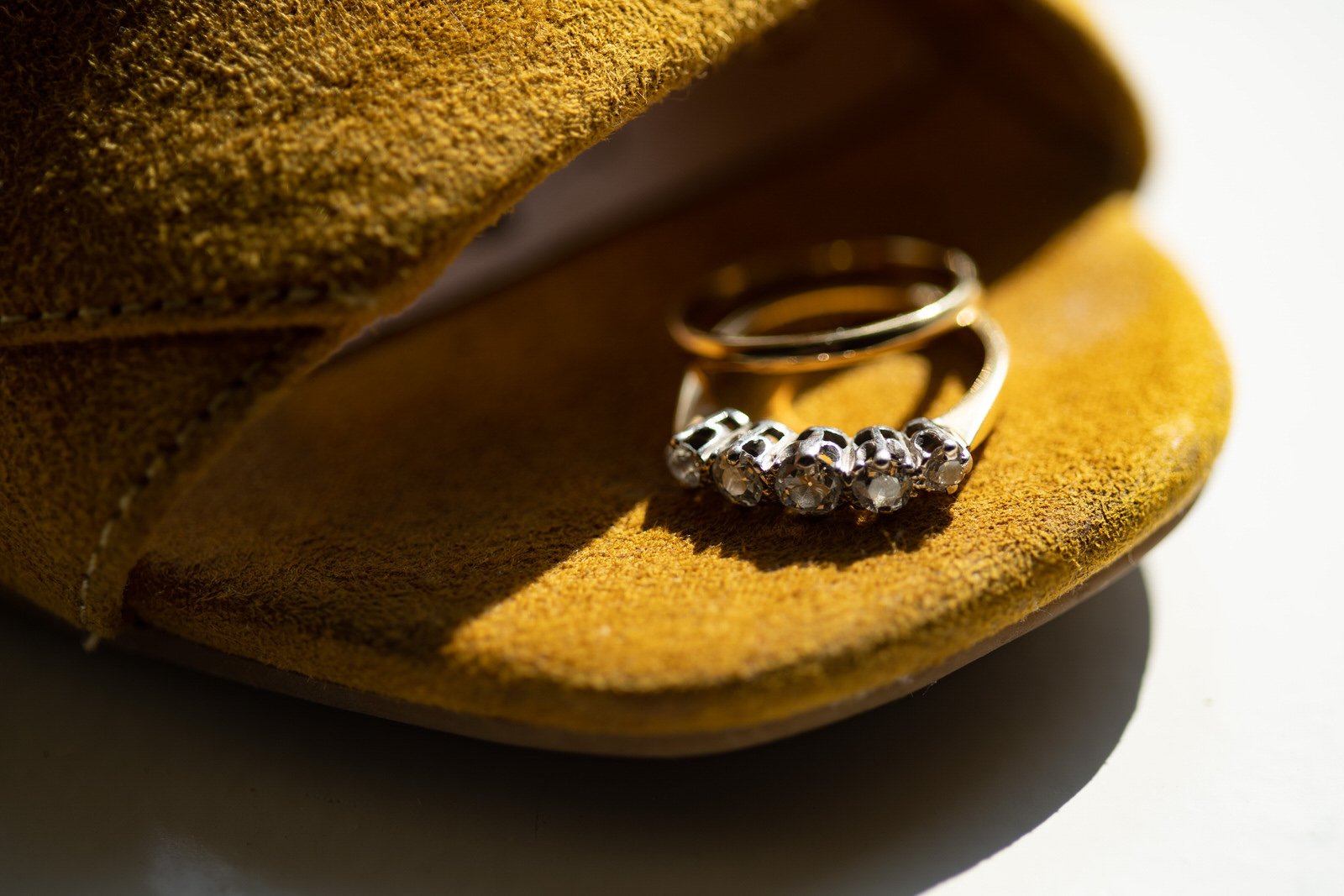 wedding rings on yellow shoes