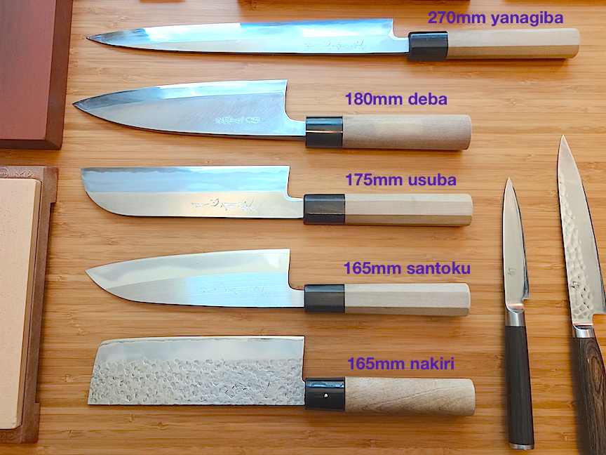 Traditional single-bevel knives (top three) and modern double-bevel knives (bottom two)