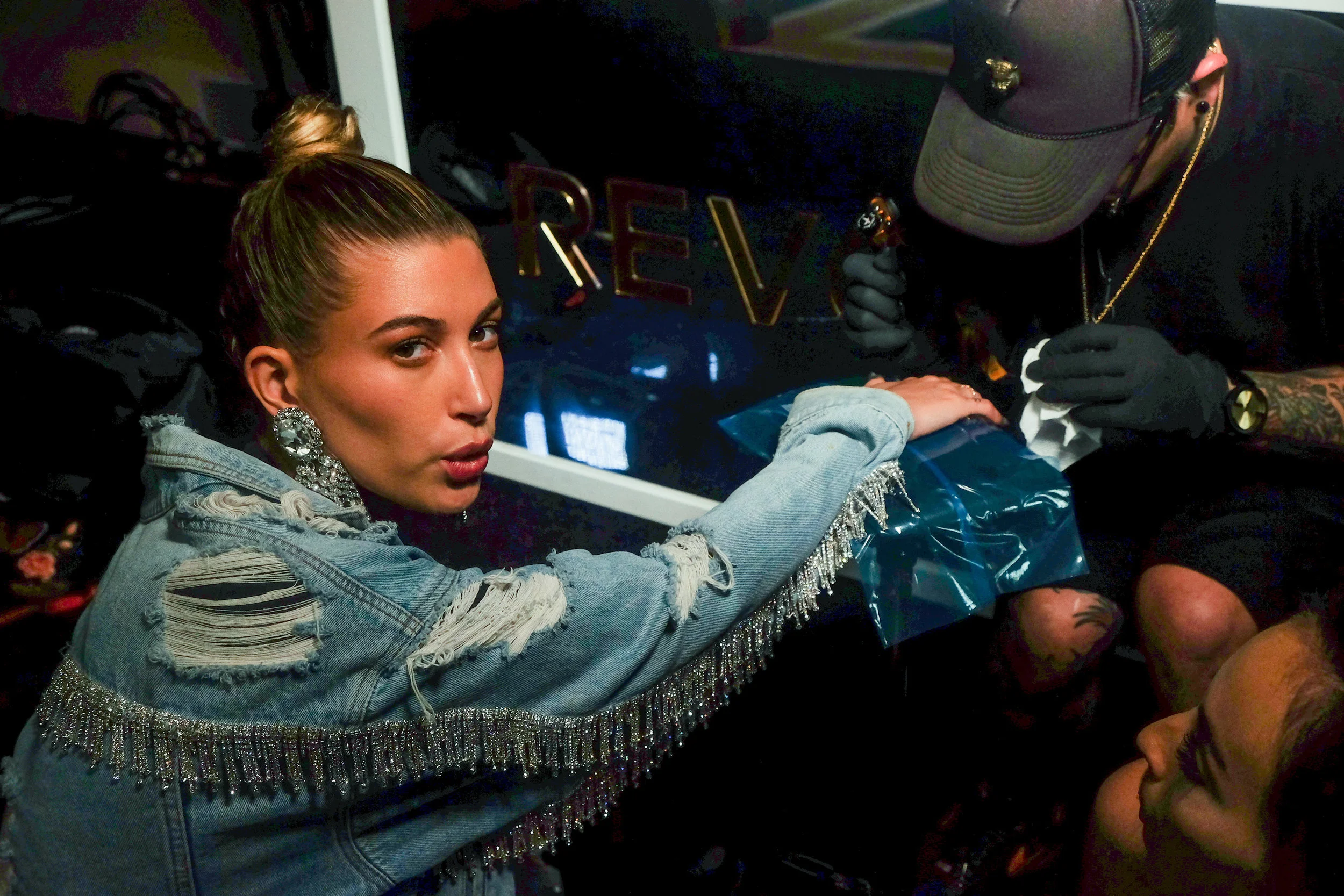 Lifestyle Photographer Los Angeles Photo Journalist Lifestyle photographer Bryant Nix, commercial advertising Photography. Hailey Baldwin (Hailey Bieber) getting a tattoo.