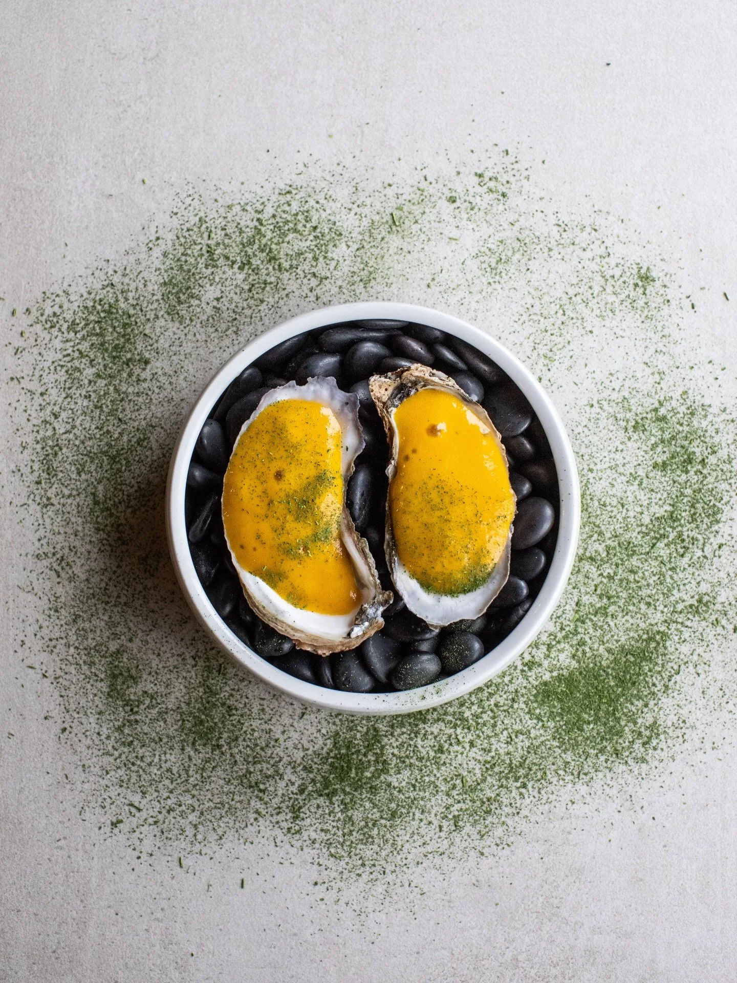 A moment of indulgence from the sea.
 Fresh oysters crowned with a vibrant golden sauce and delicate herbal notes&mdash;simple, elegant, and full of flavor.

Reserve your table and enjoy an incredible selection of dishes inspired by the vibrant spiri