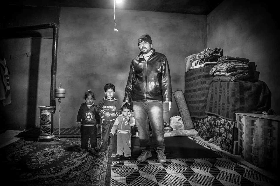 This Syrian refugee family of five were about to be evicted from their small, cold room in al Marj village, in Lebanon's Beka'a Valley because they could barely afford to pay the rent. © Christina Malkoun/IRIN