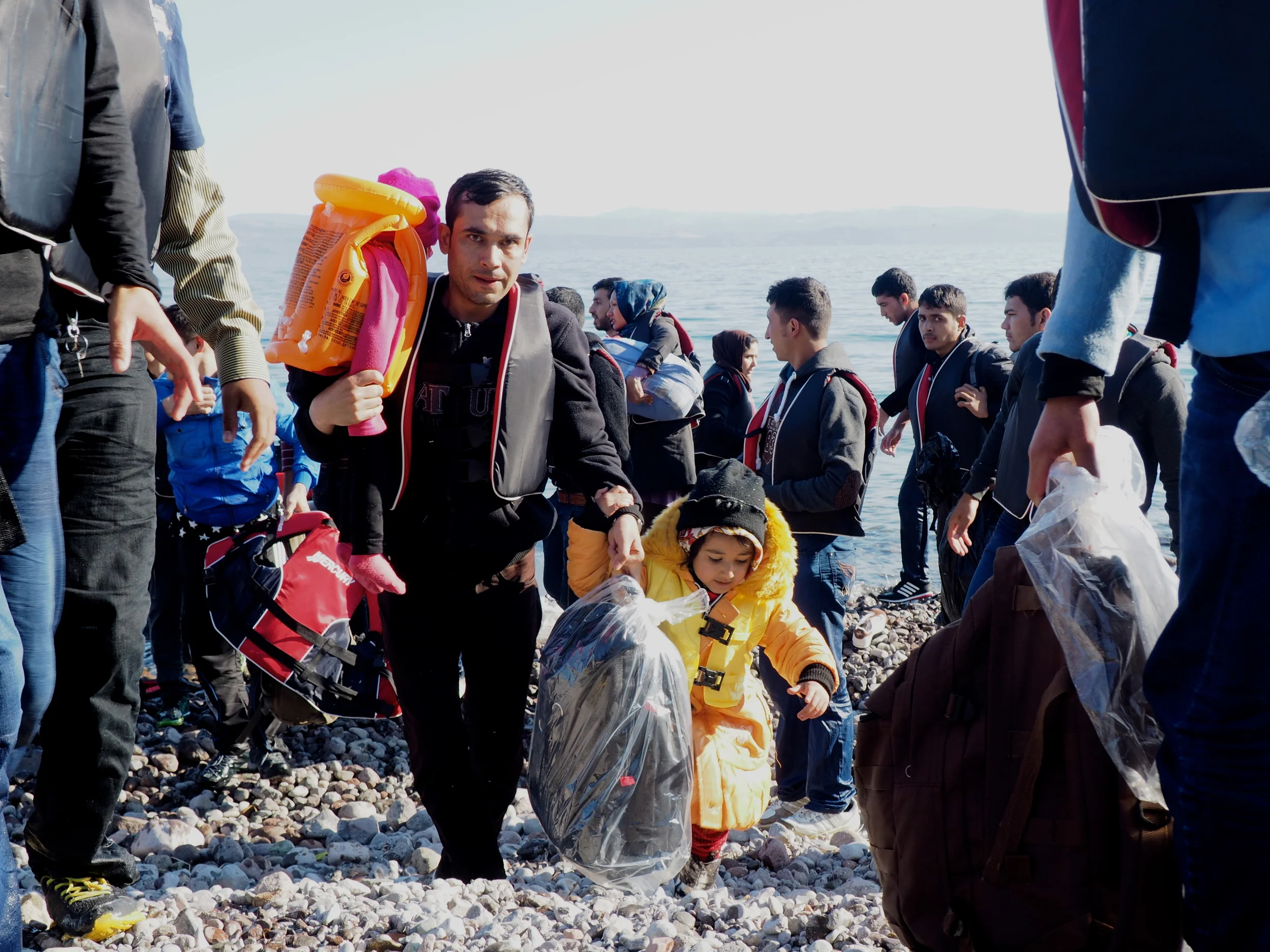 A migrant family comes ashore at Sklala Sykaminias. The majority of arrivals to Greece are Syrians, followed by Afghans. 