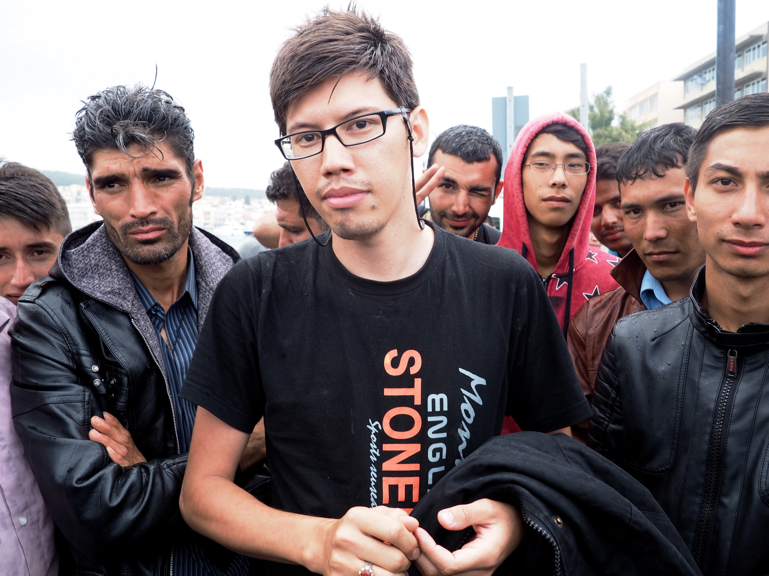 Vahab (in the centre), from Afghanistan, has been sleeping rough in Mytilene for the past three days