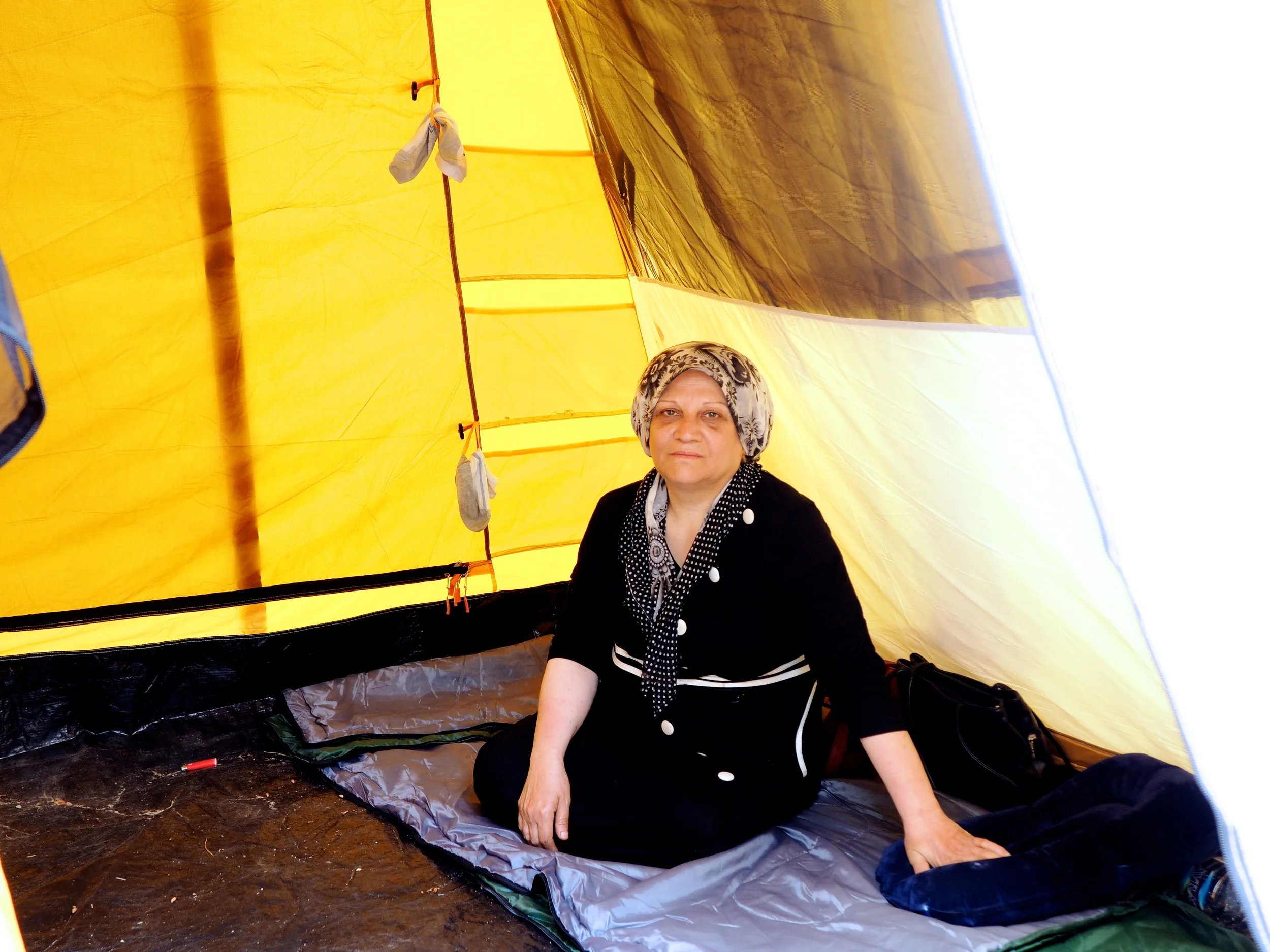 Obeyda, from Syria, in one of the tents at the detention centre