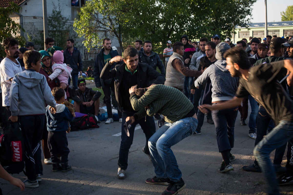A fist fight breaks out after a man is suspected of trying to jump the long queue of people waiting for buses in Tovarnik. 