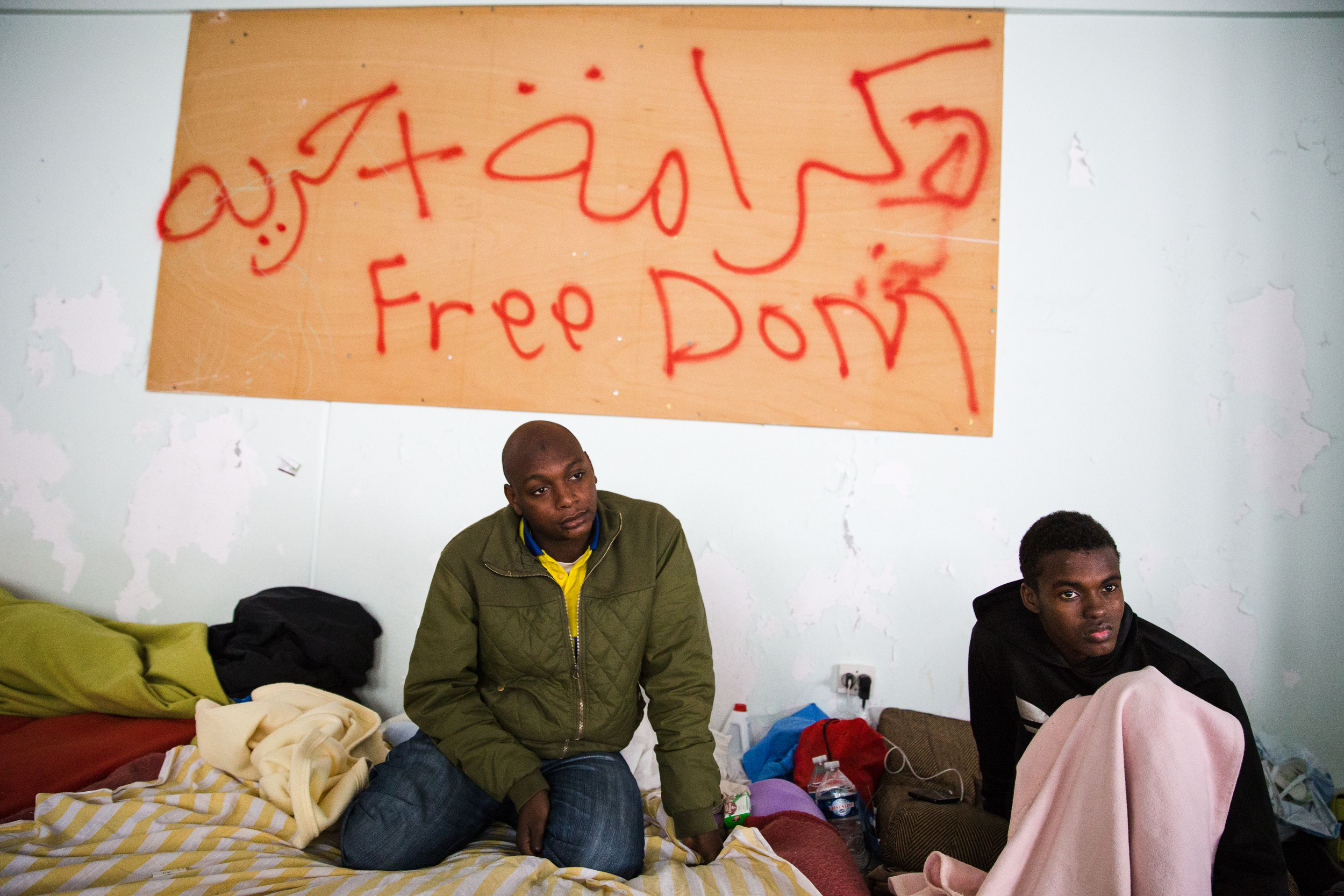   These two Sudanese met here. Hussein (right), 19, came to France in late September and says he has trouble adjusting to the cold weather.&nbsp;  