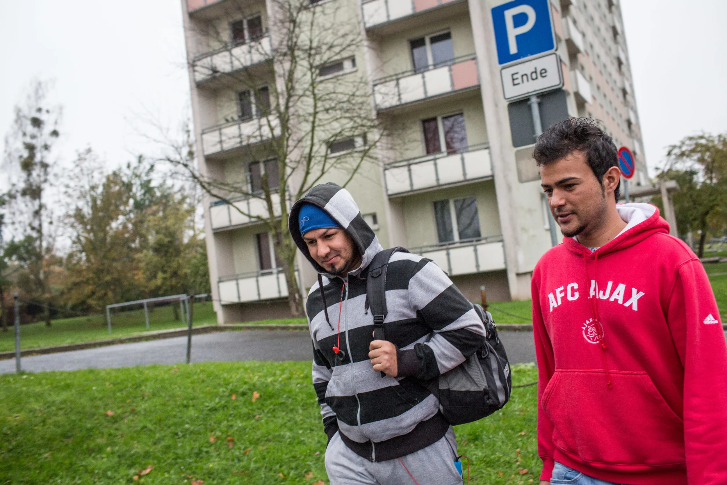 Two Afghan refugees walk through Sonnenstein where the majority of Pirna's refugee population are housed (Andrei Pungovschi/IRIN)