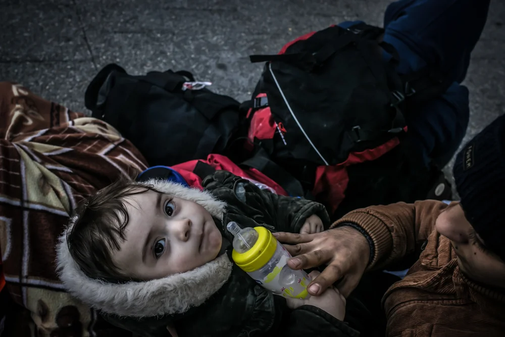 Syrian children among a group of refugees at Basmane bus station who were returned to Izmir after their boat was turned back (Nicola Zolin/IRIN)