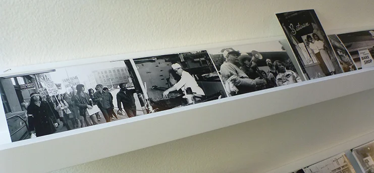 Photos of community activism in the CID serve as decor. Photo by Jill Wasberg.