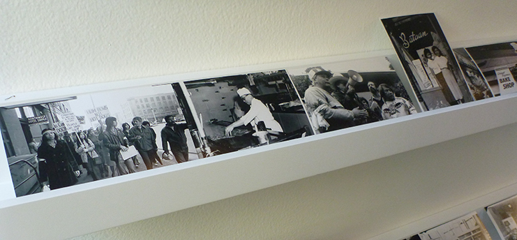 Photos of community activism in the CID serve as decor. Photo by Jill Wasberg.