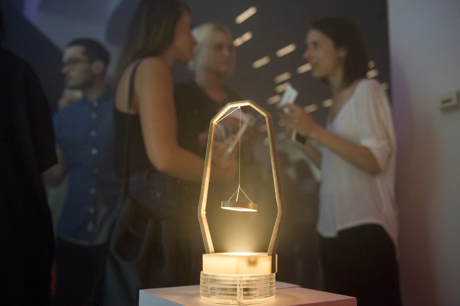 Airy Light by Annelie Berner depicts the room's air quality through projecting light patterns on the ceiling. Photo via Red Bull Studios.
