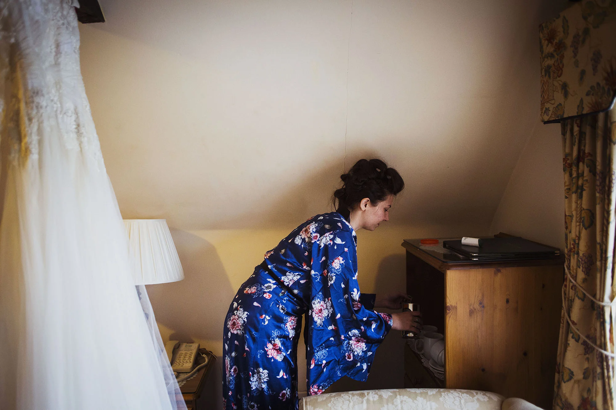 bride getting ready for wedding and wedding dress at grasmere house hotel