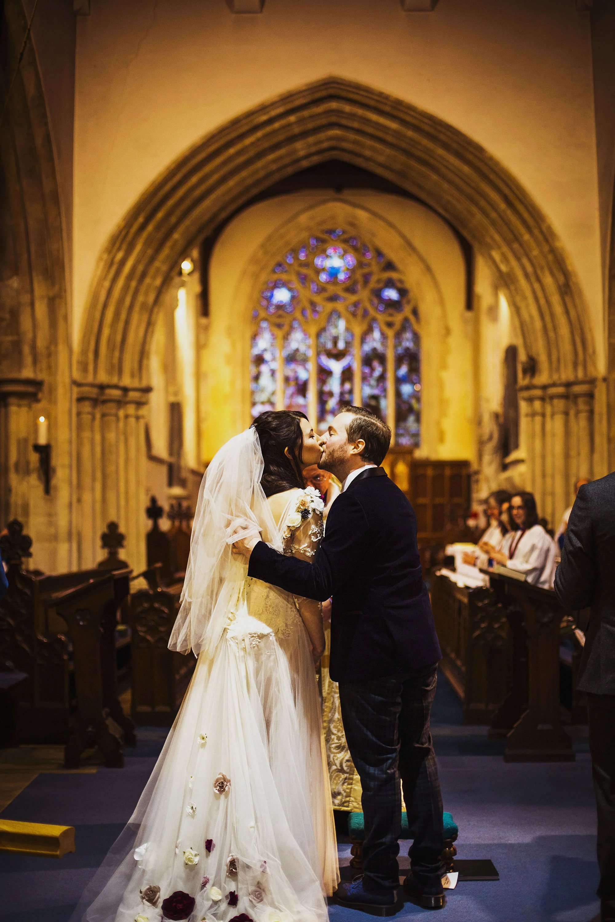 bride and groom first kiss at st laurence church