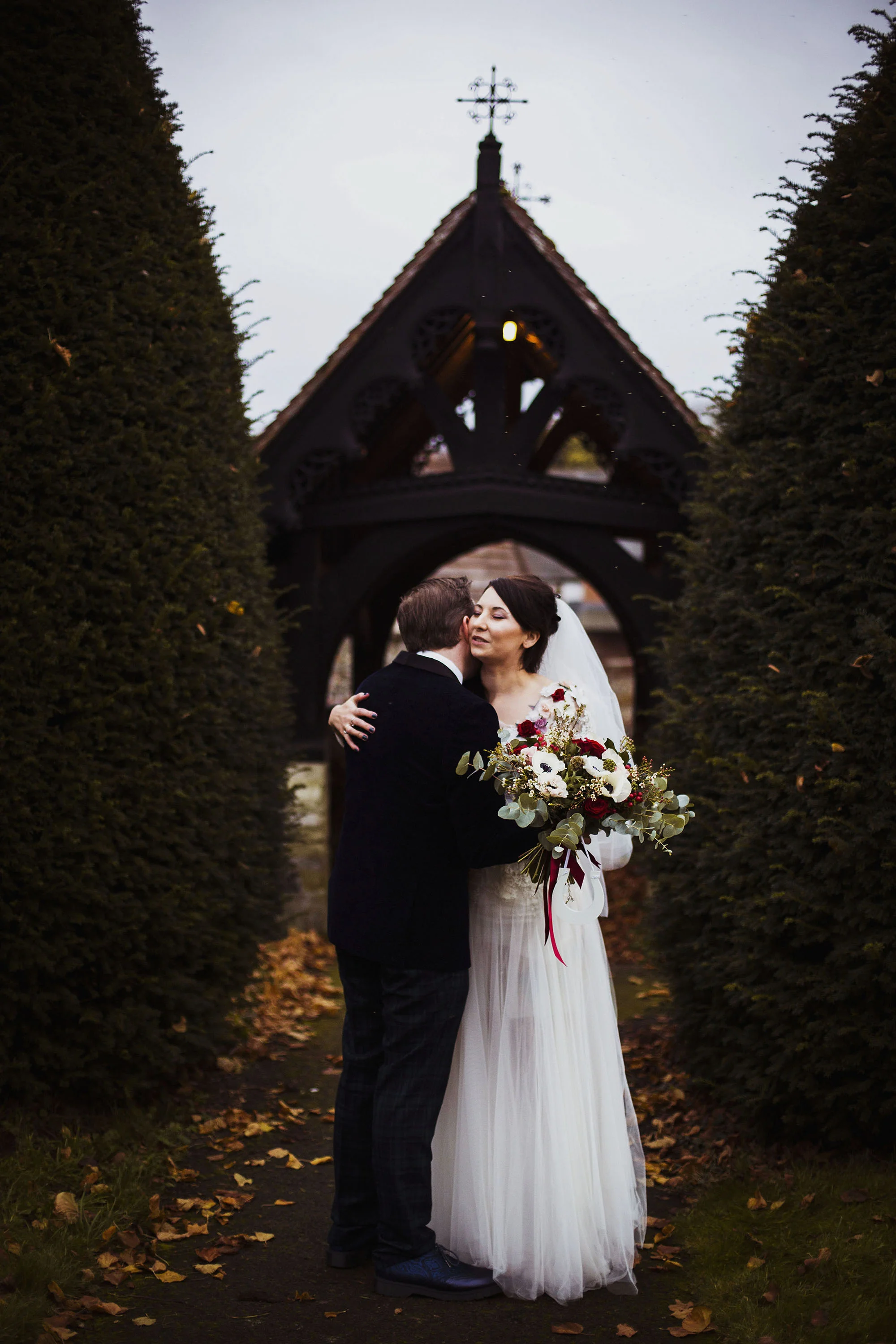 bride and groom having a cuddle just married at st laurence church