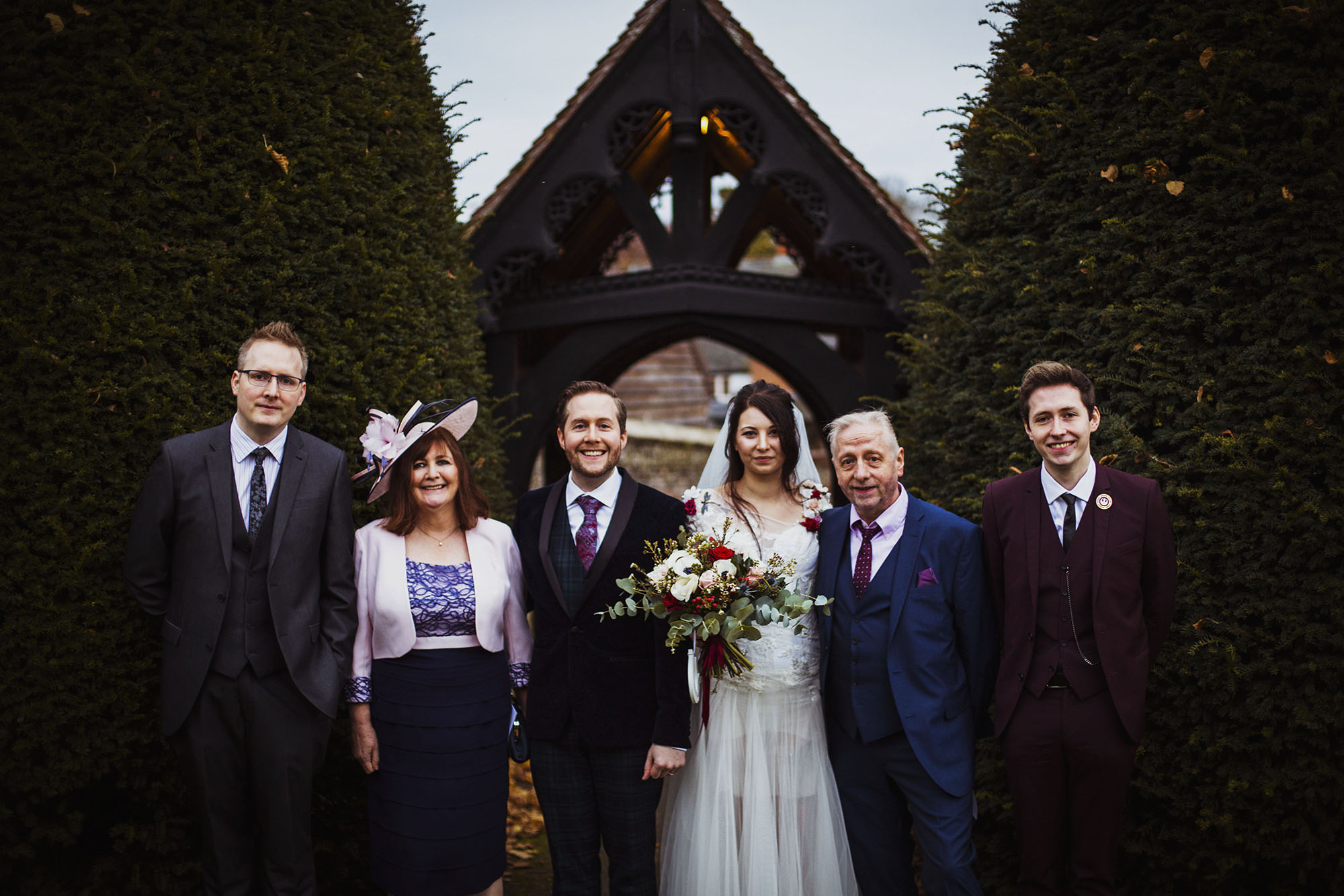 bride and groom with groom's family at st laurence church