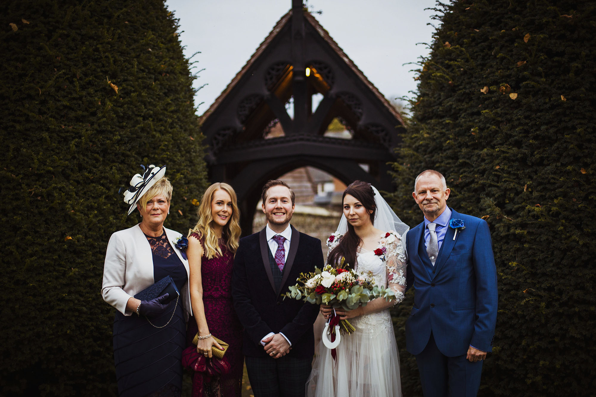bride and groom with father of the bride's family