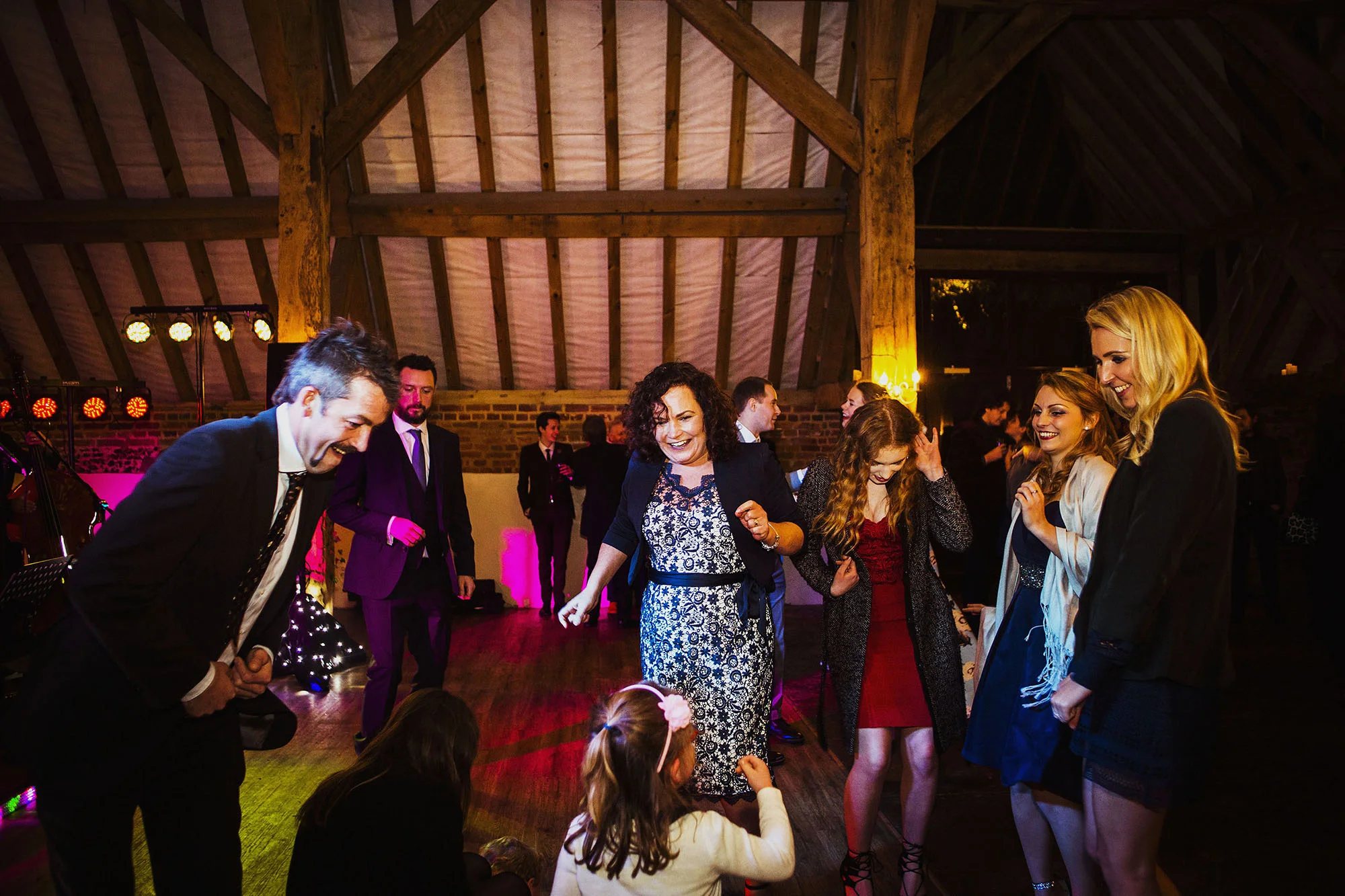 wedding guests dancing at wedding reception at barford park wedding venue in wiltshire