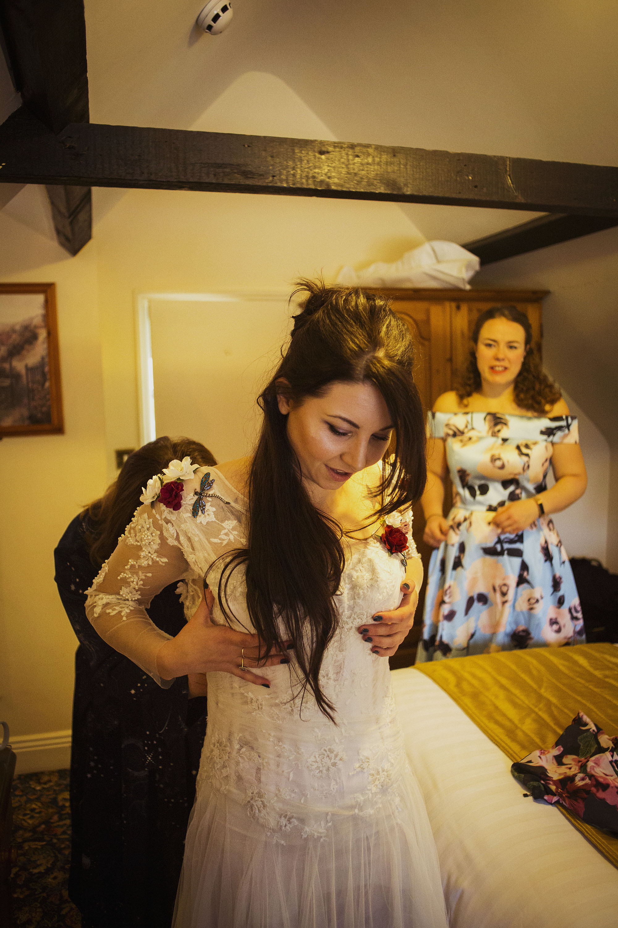 bride getting into wedding dress at grasmere house hotel in salisbury