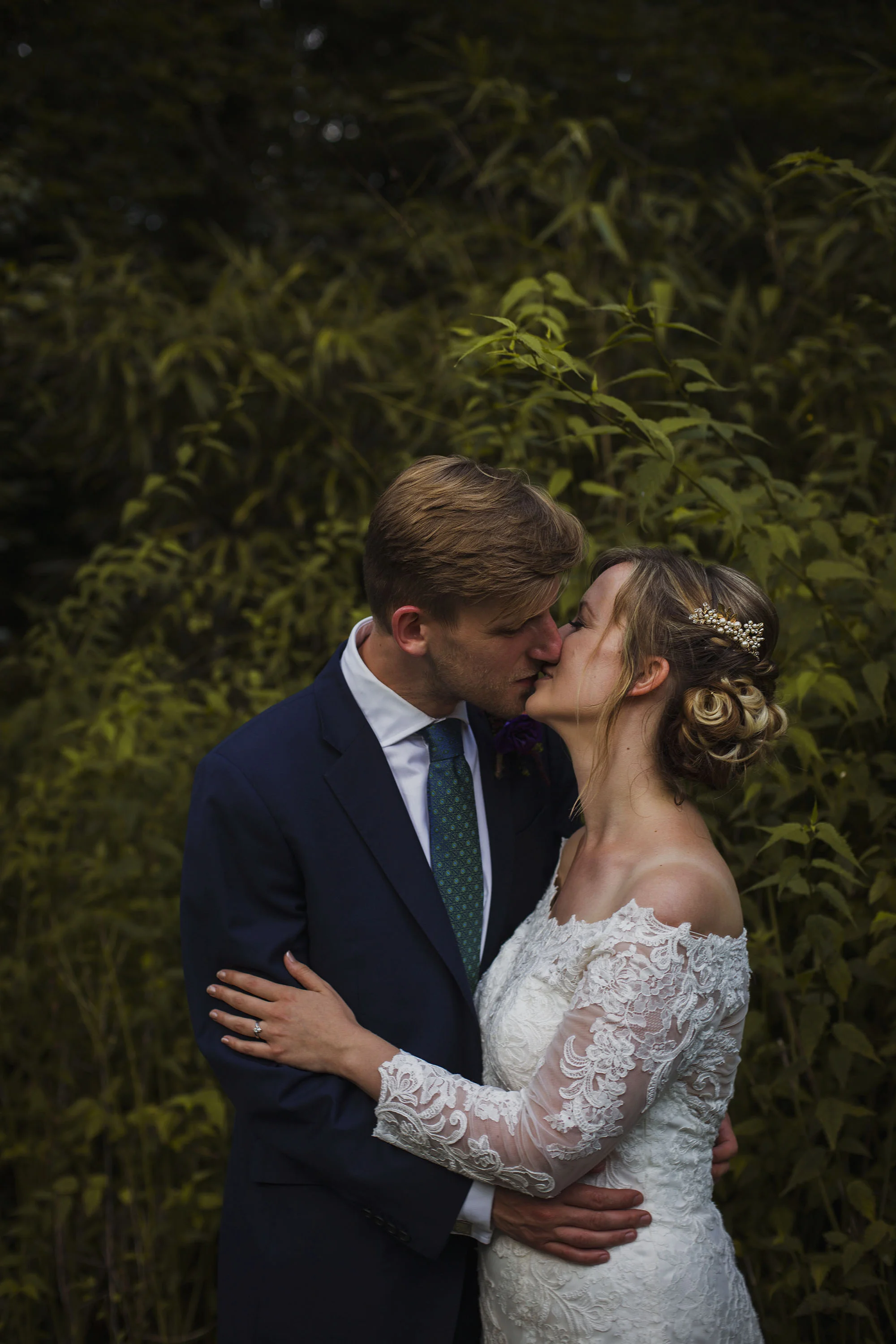 bride and groom kissing portrait