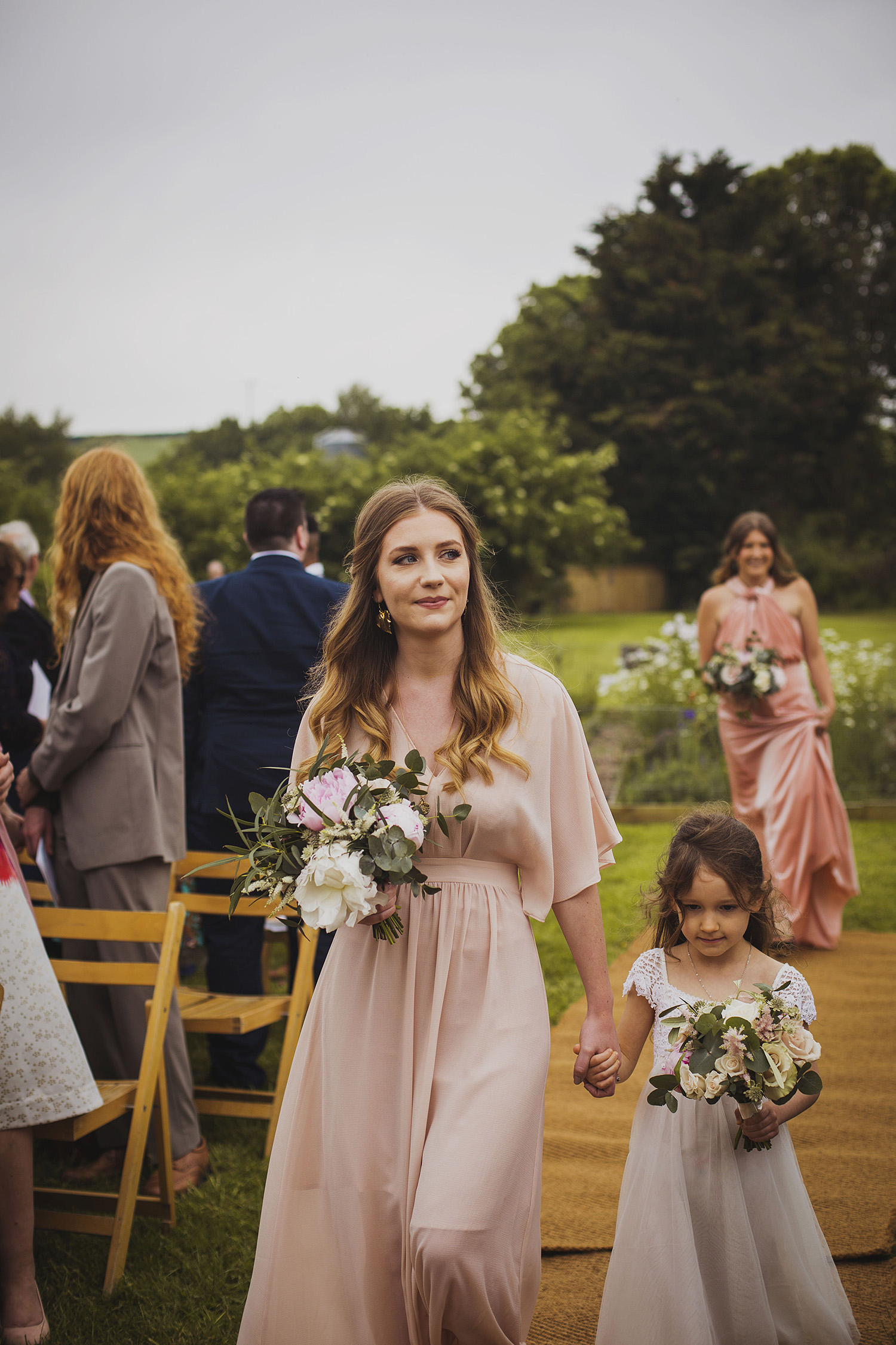 bridesmaids arriving at cott farm barn somerset wedding venue
