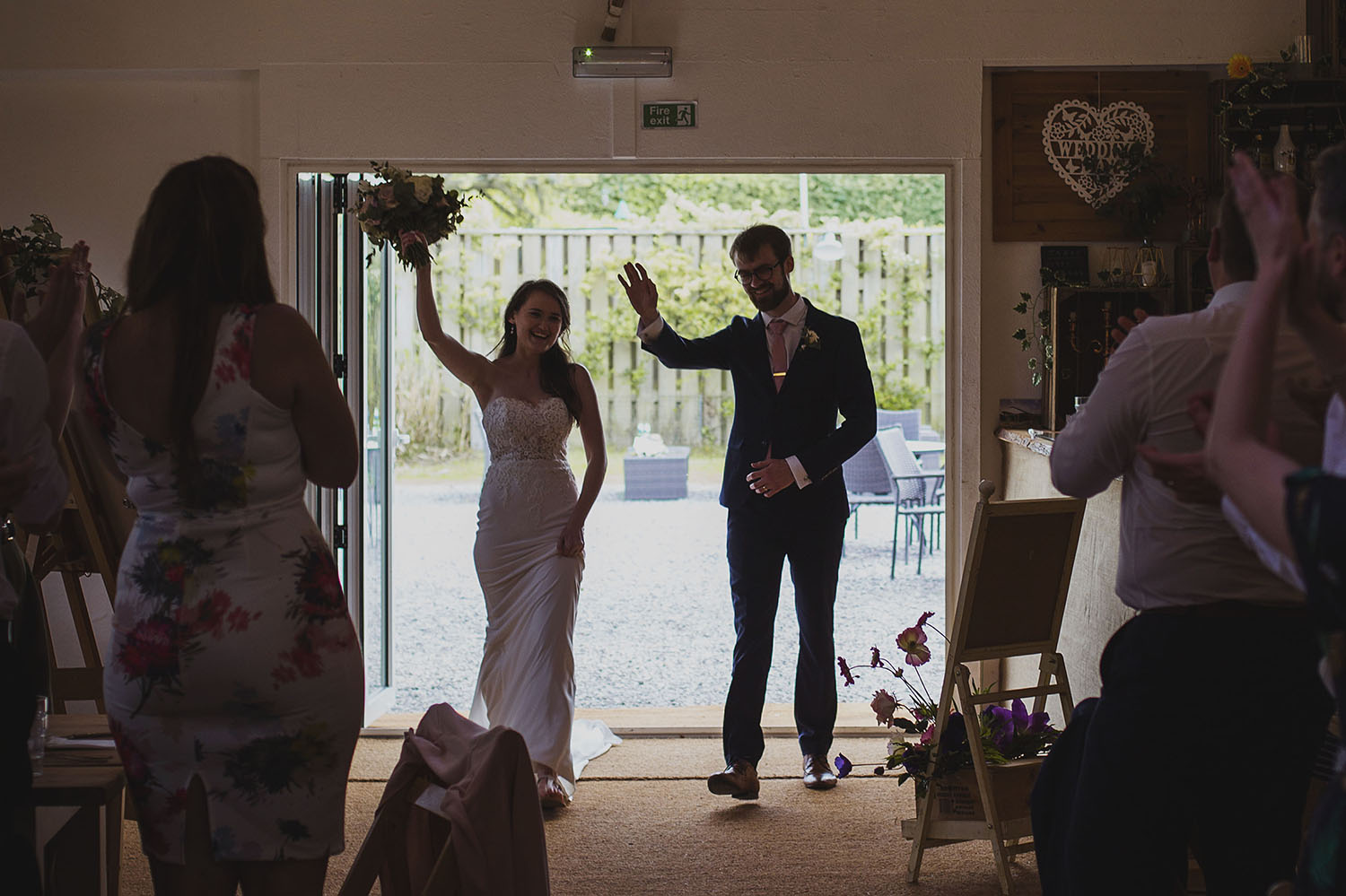 bride and groom entrance at cott farm barn wedding venue somerset 