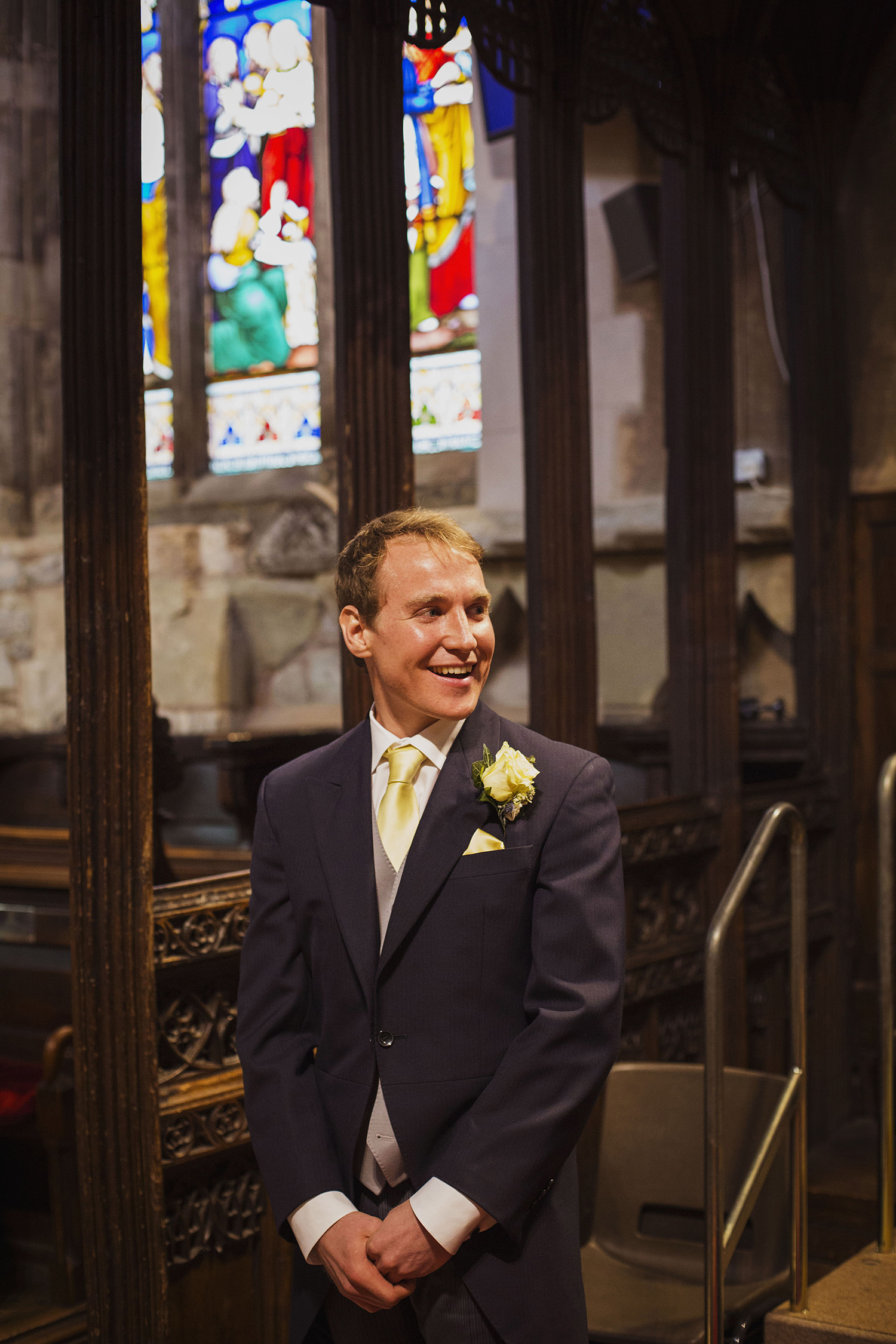 groom's reaction at guests arriving at knowle parish church diy wedding