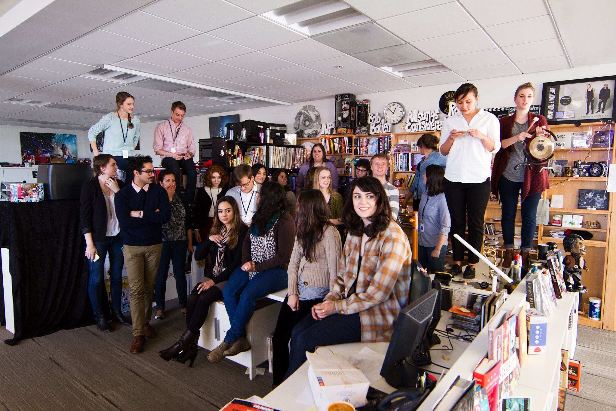 Caroline's NPR intern class. Caroline, at right, is standing on the one and only Tiny Desk.