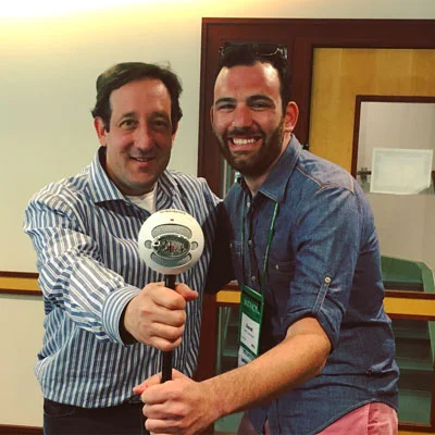 Two Skidmore alumni, David Miner '91 and Jared Greenbaum '12, meet during the recording of one episode of This is Skidmore. The aforementioned Snowball Mic is featured prominently.