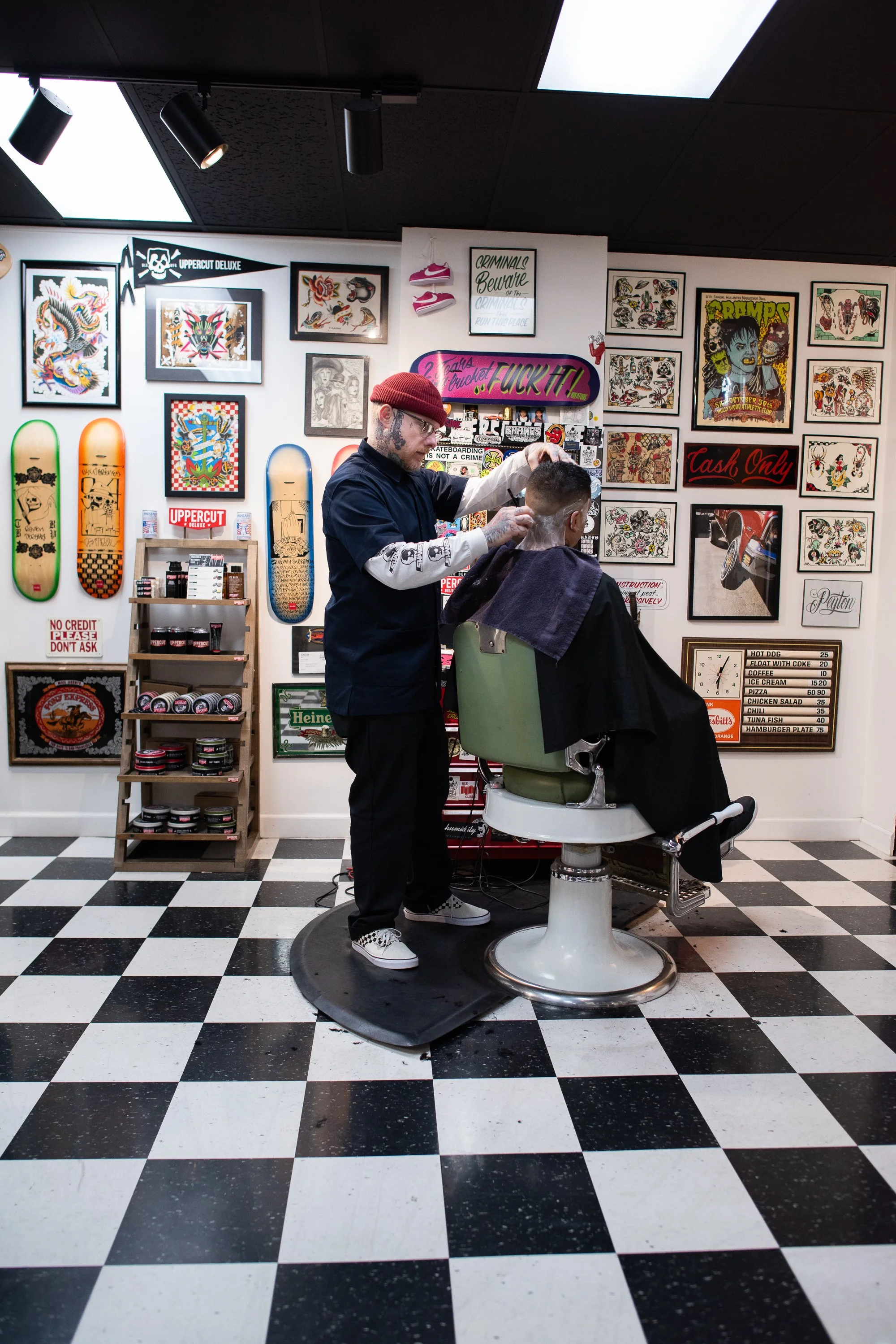 barber Shane Nesbitt cutting hair in vintage barber chair inside Shane's Barbershop San Mateo