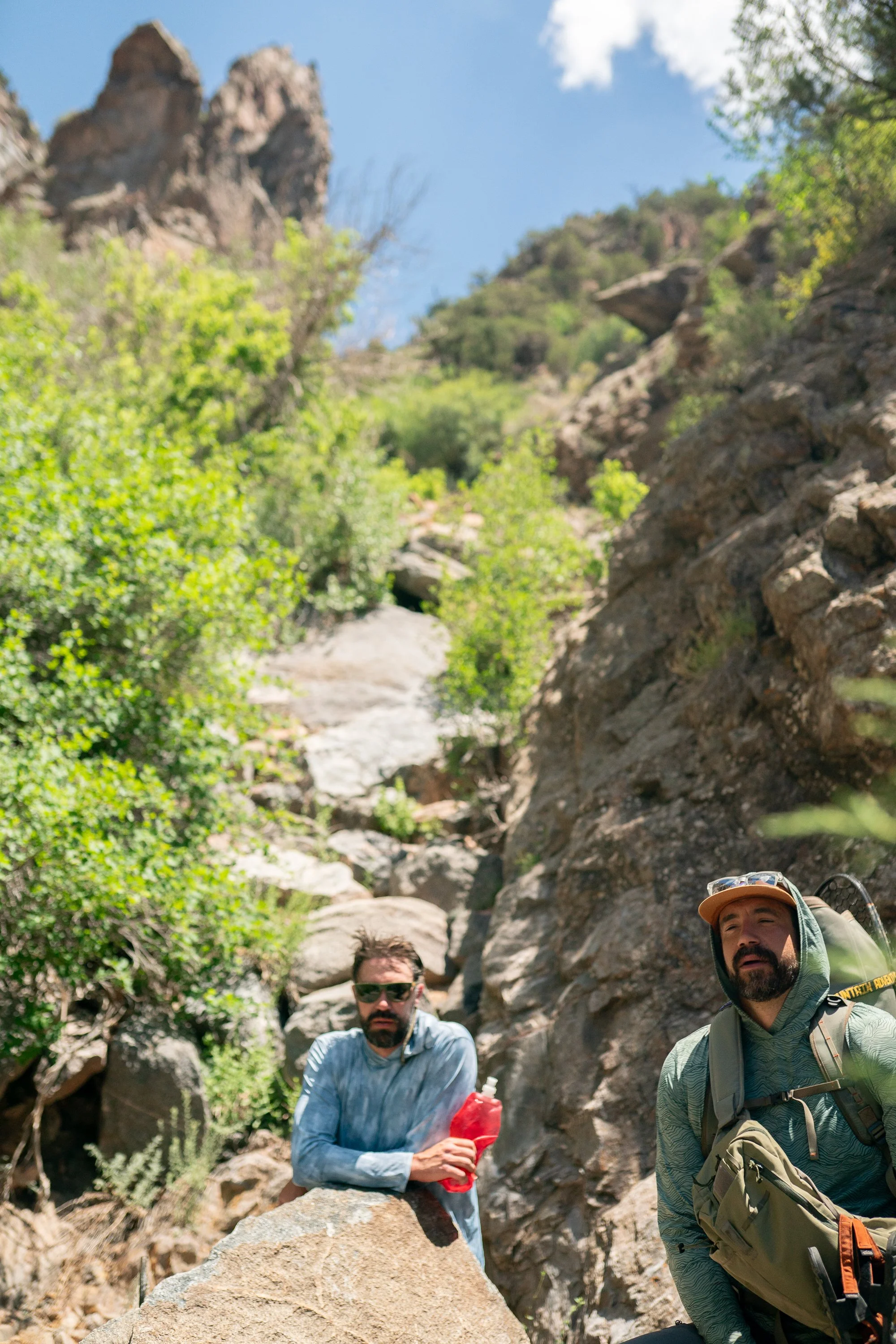 A fly angler climbs steep terrain out of the Black Canyon of the Gunnison