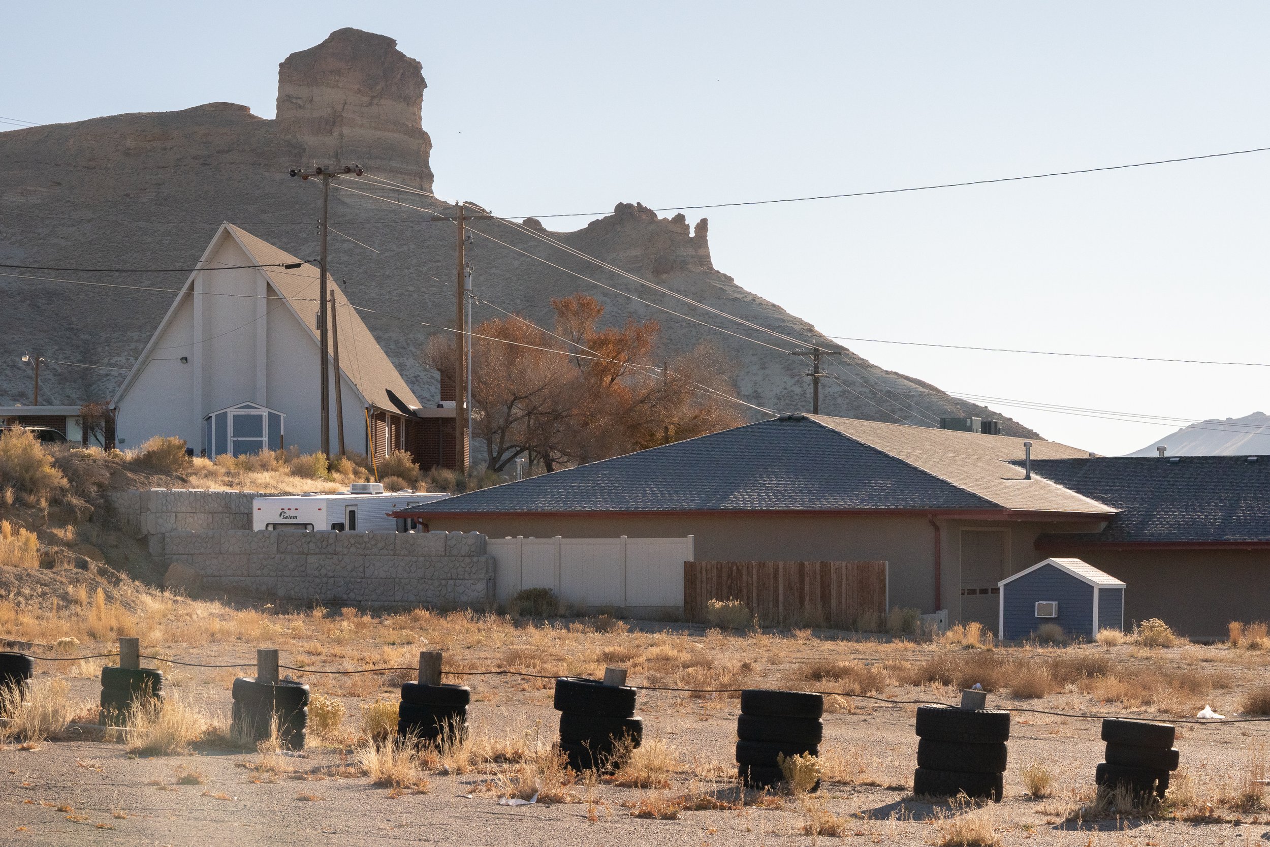 Small Wyoming town with homes and a mountain rising behind them