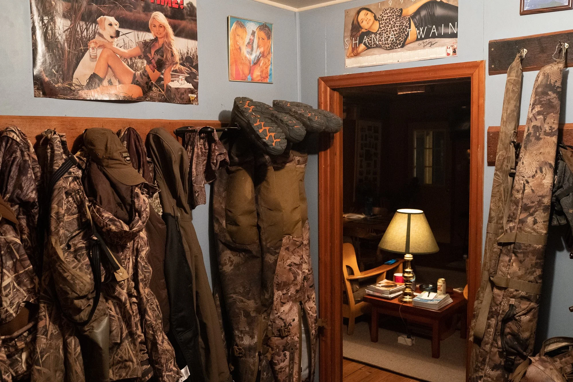Duck hunting gear and waders hang inside a waterfowl hunting lodge during hunting season in Ontario