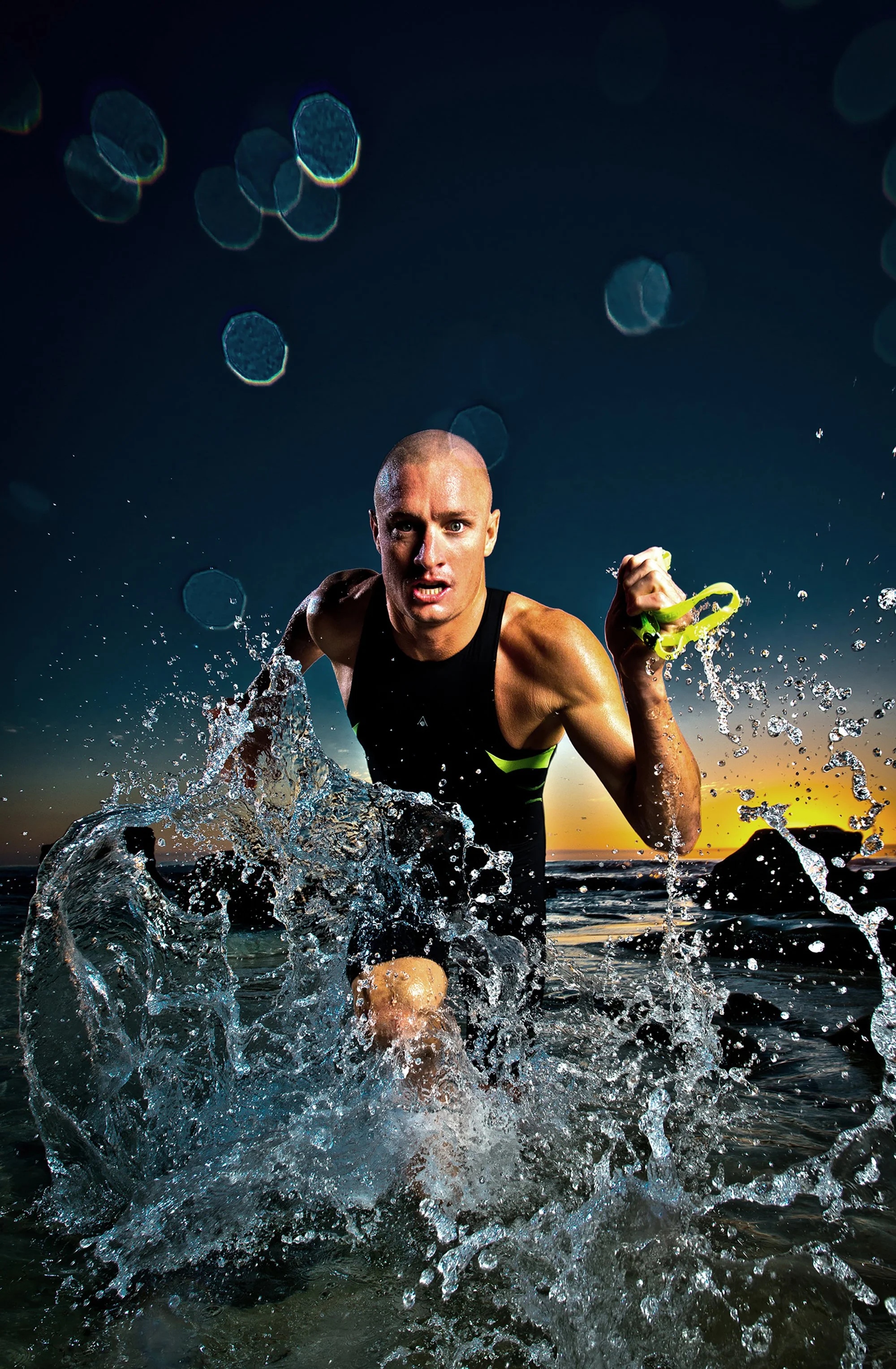 Triathlete running through water during open water swim training