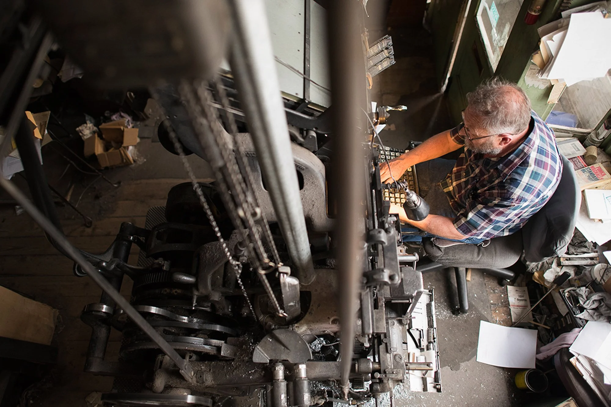 Dean Coombs working beside the Linotype machine