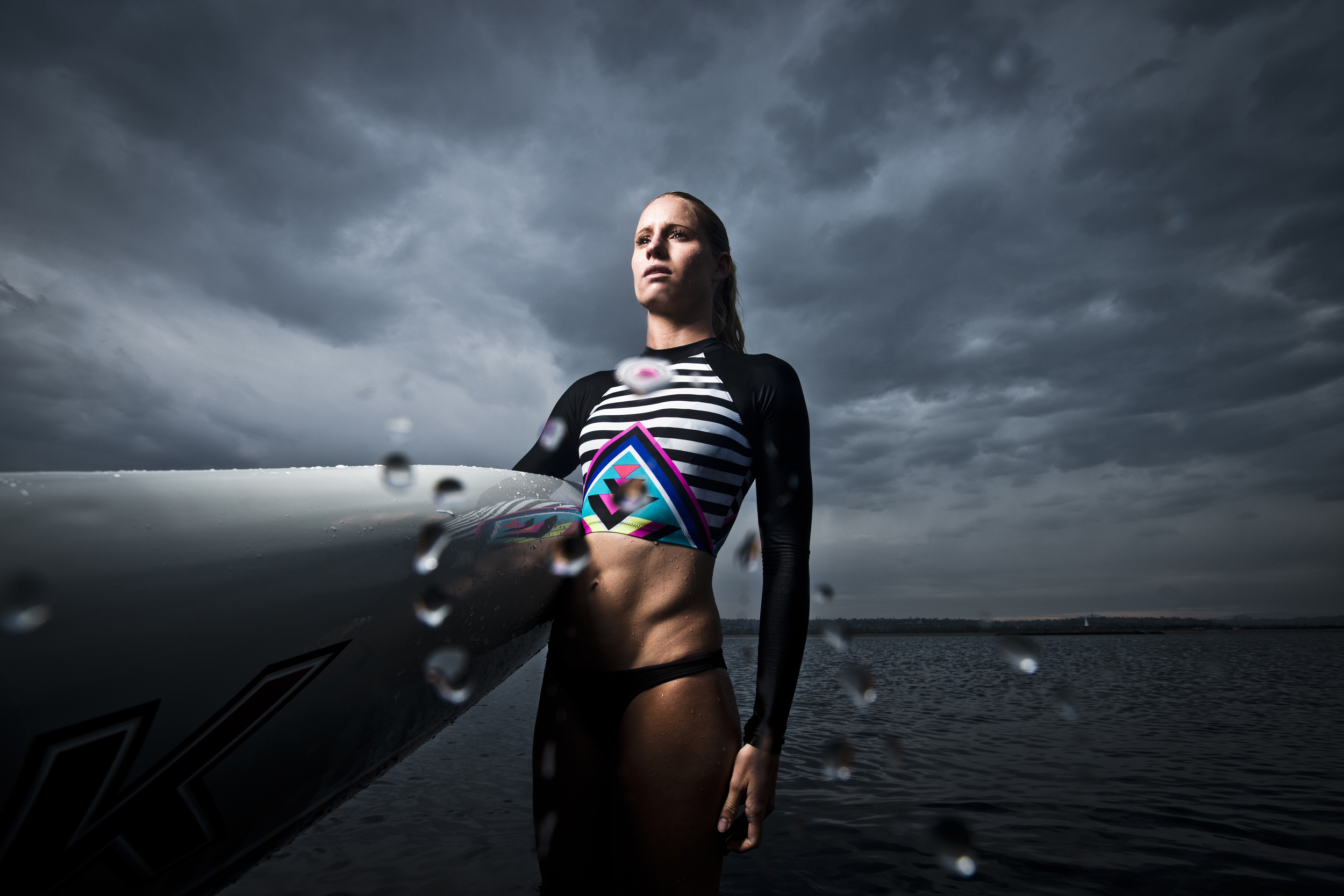  Gritty photographs of a female professional long distance paddle boarder  