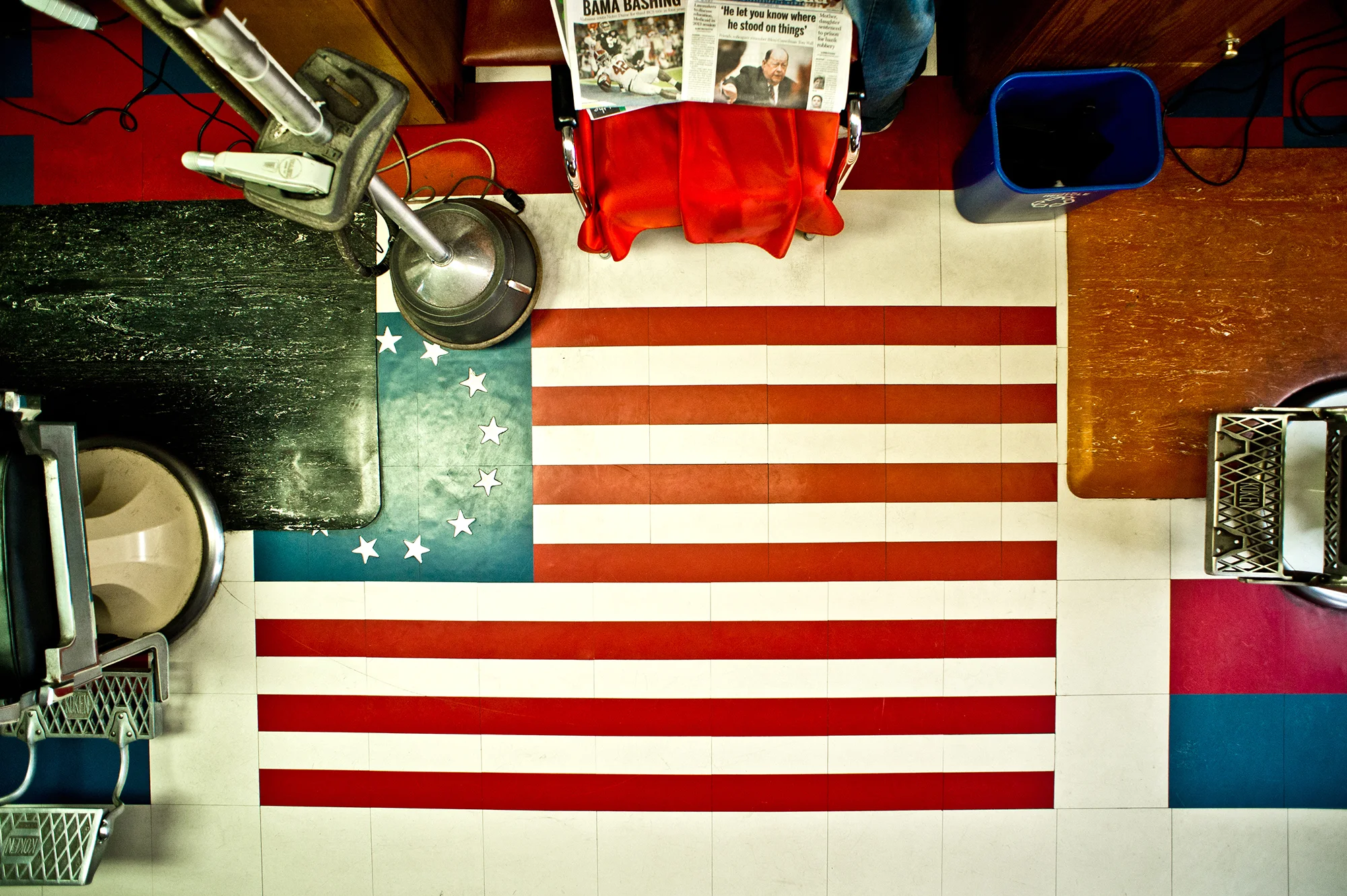  Red’s Barbershop - Mississippi   Traditional barbershop with American flag on the floor - Barbershop coffee table book.   Rob Hammer  