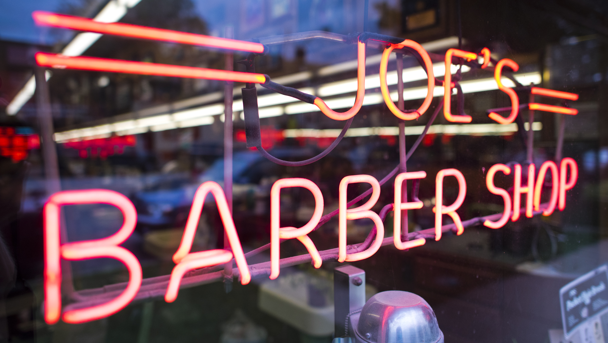 Neon barbershop sign at traditional barbershop in Chicago 