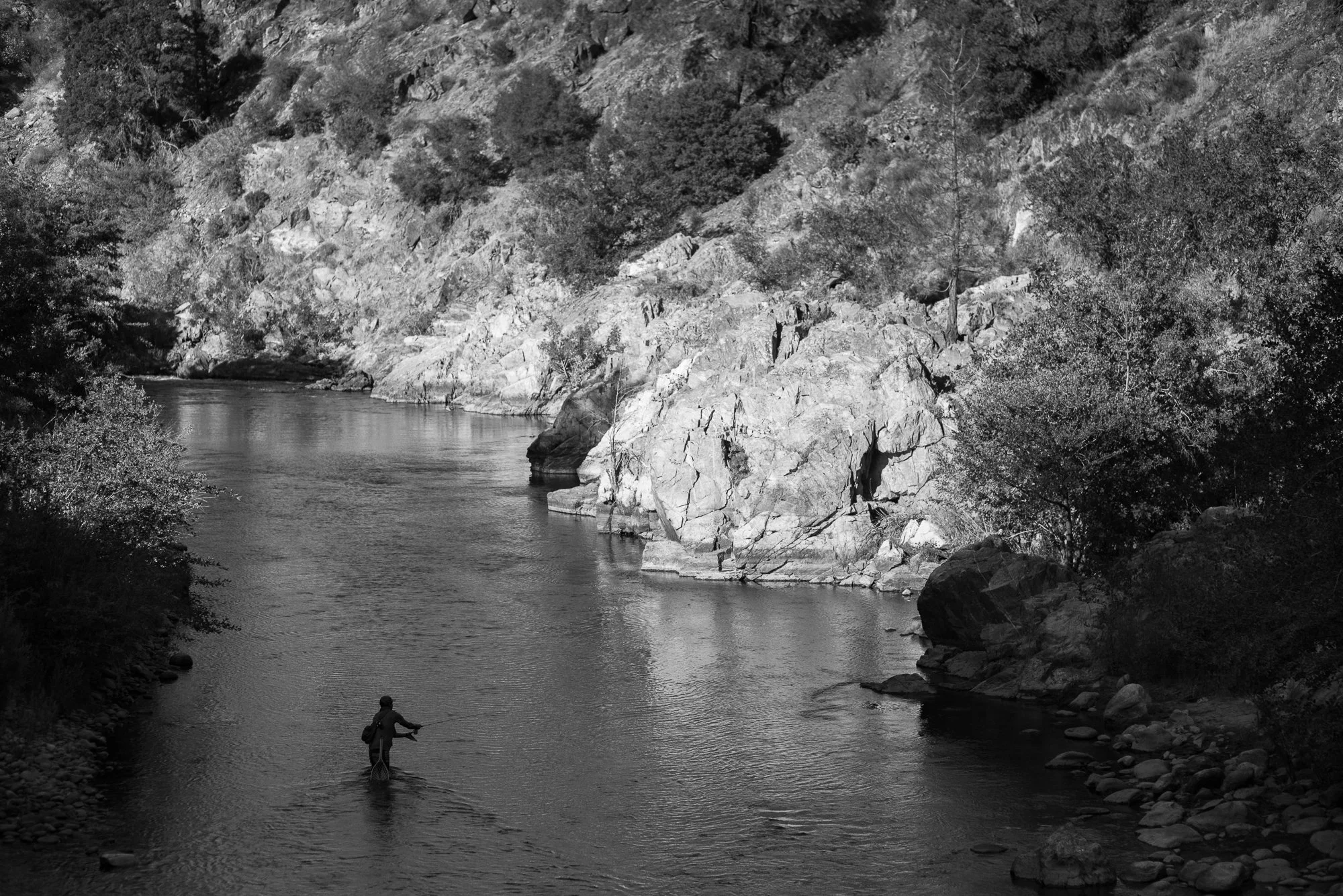 Black and white photograph of fly fishing on the Kern River