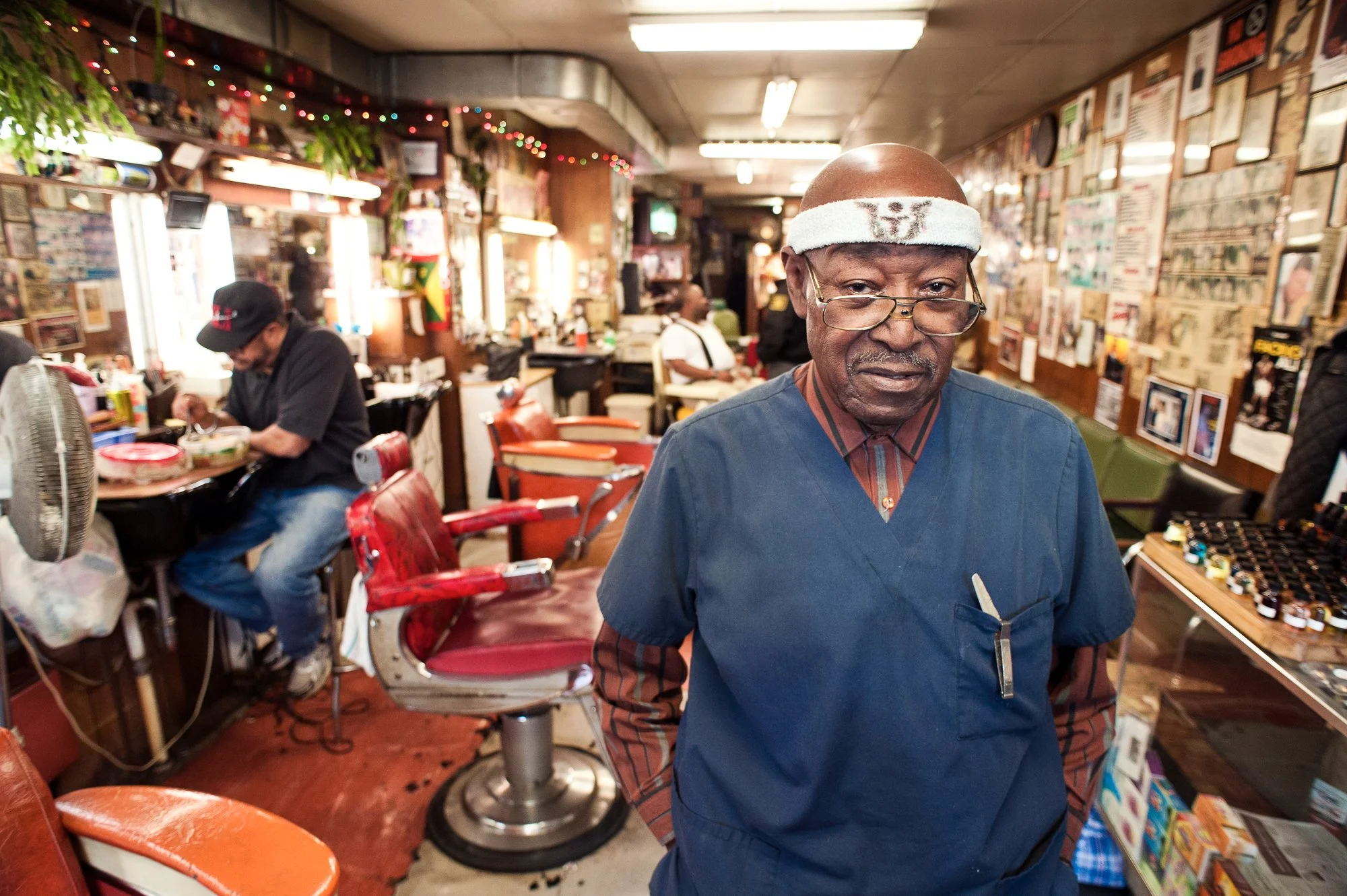  Photograph of a barber in his traditional barbershop in Albany, New York 