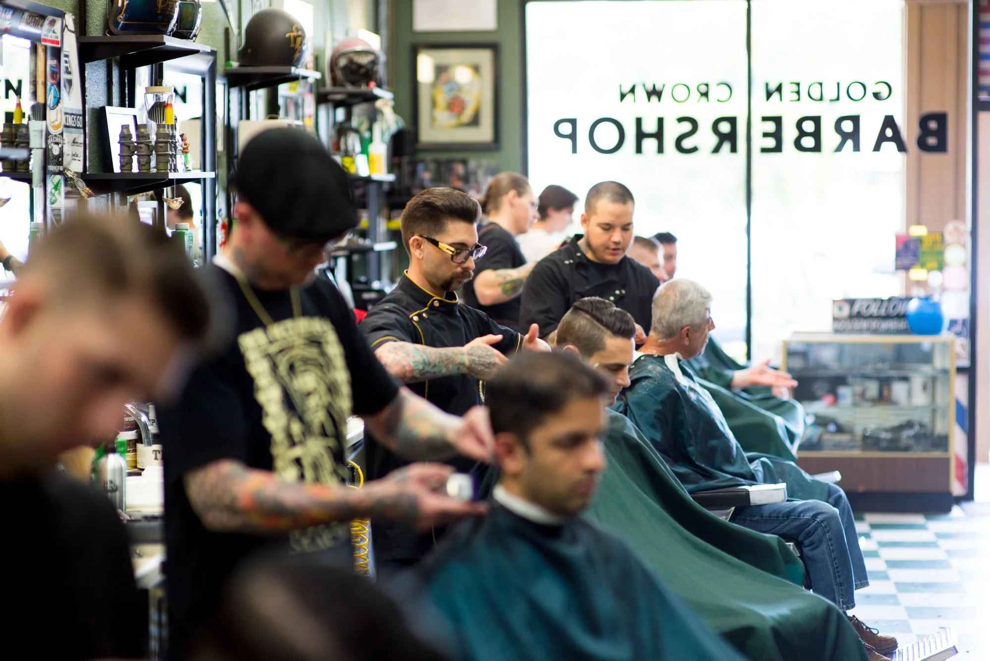  Photograph of people getting haircuts at The Golden Crown - best barbershop in Orange County  