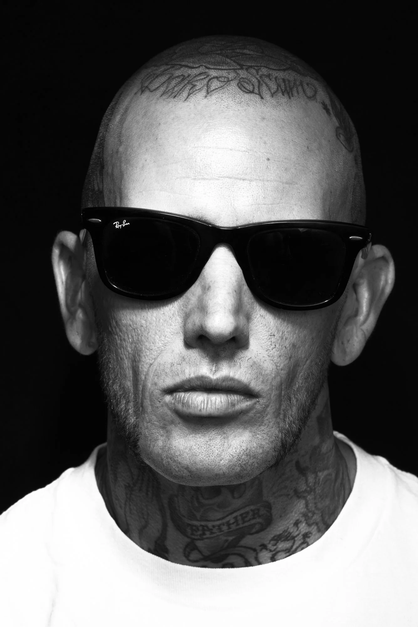  Portrait of a barber with head tattoos  