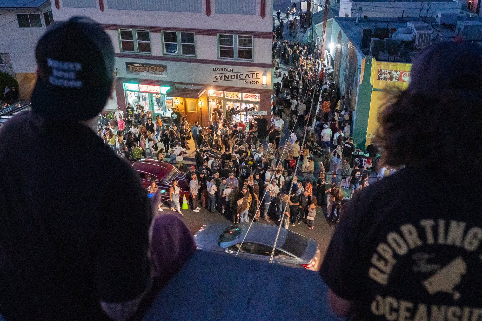  Photograph of people filling the street during a part at Syndicate Barbershop in Long Beach, CA 