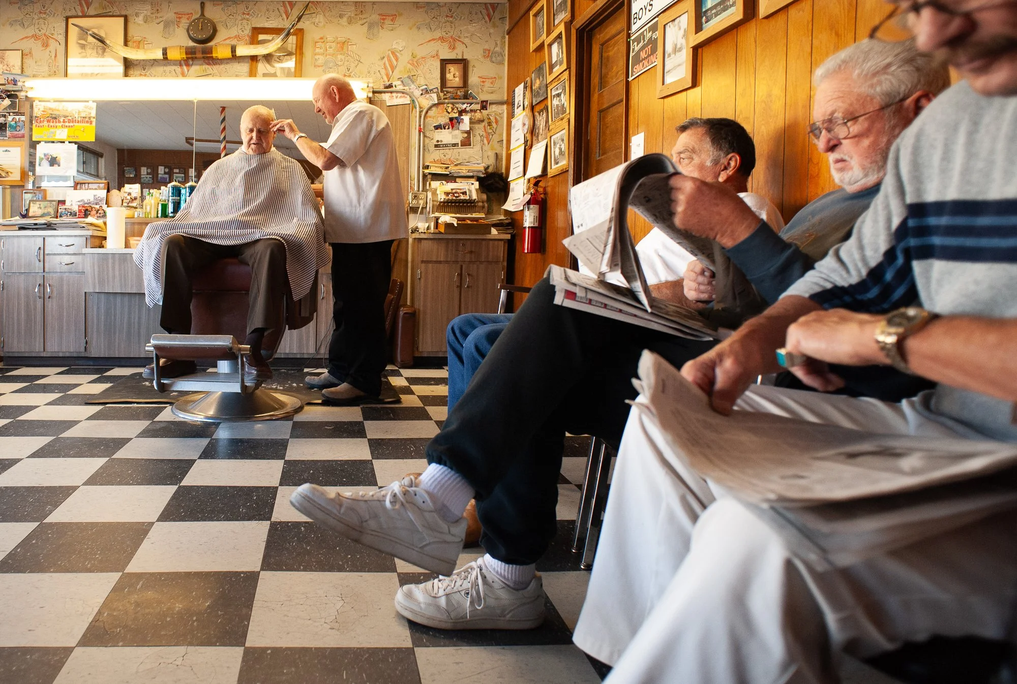  Photograph of a customer getting his haircut at City Barbershop in Ramona, California 