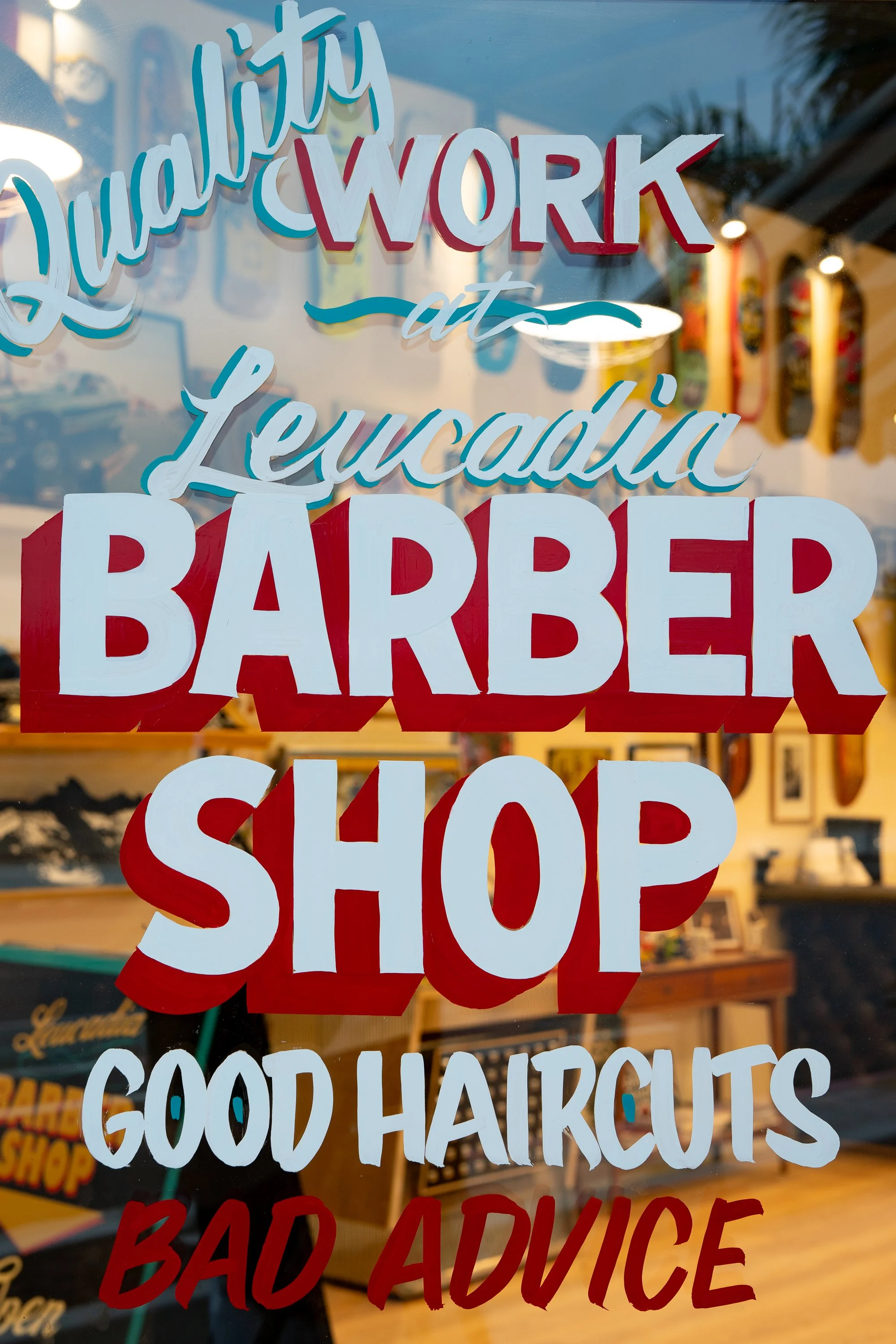  Photograph of the hand painted lettering on a barbershop window. Part of an ongoing photography series documenting traditional barbershops in all 50 states of the USA.  