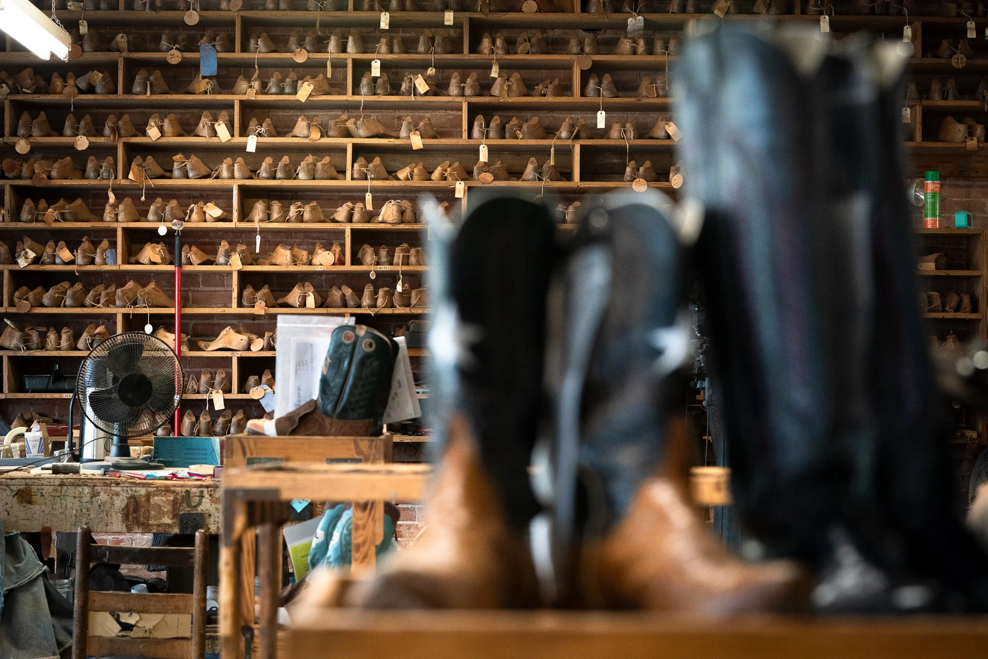  Boot lasts fill the shleves at a workshop where people make custom cowboy boots by hand 