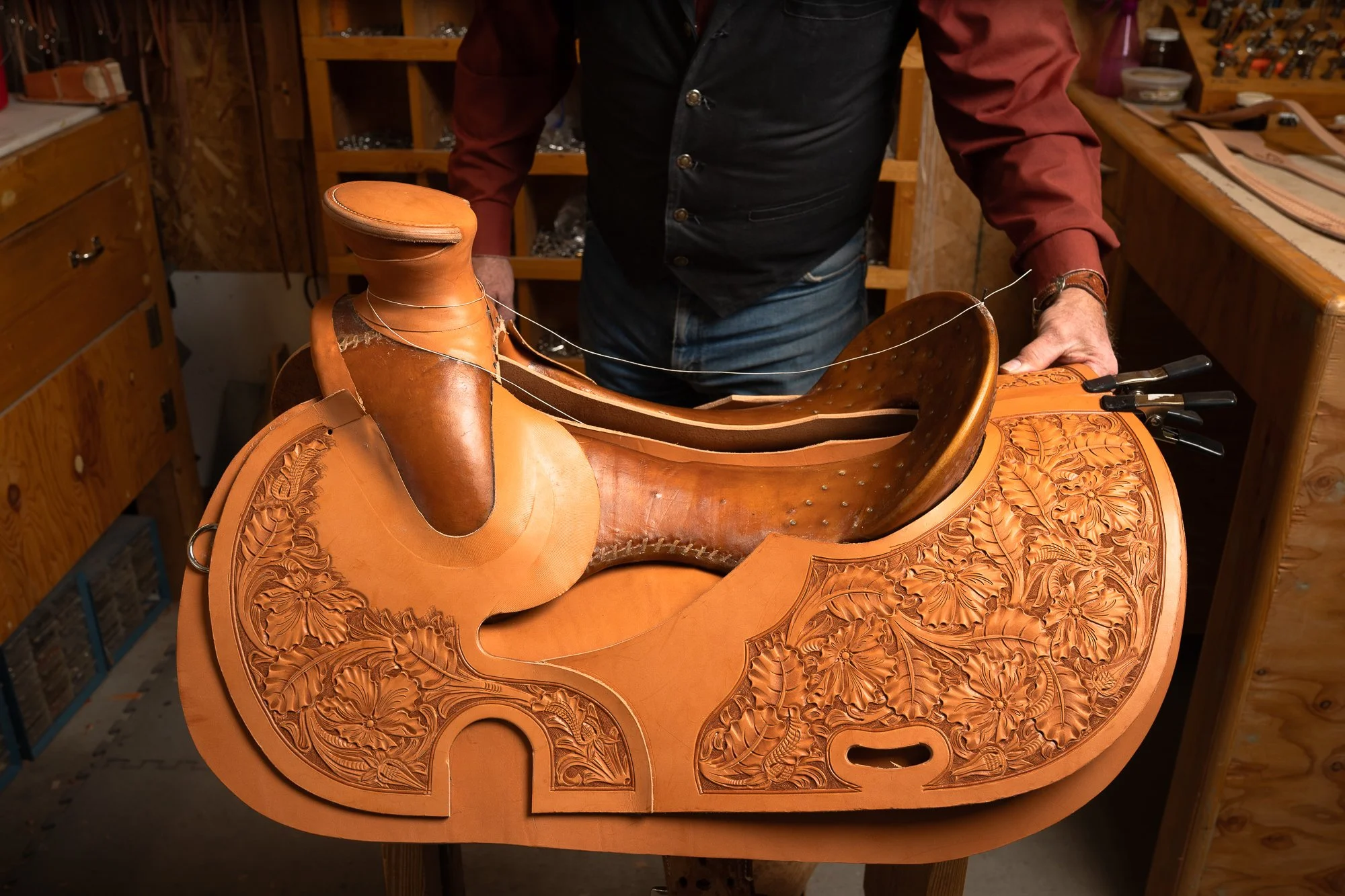  Progress photo of a traditional western saddle being made by hand 
